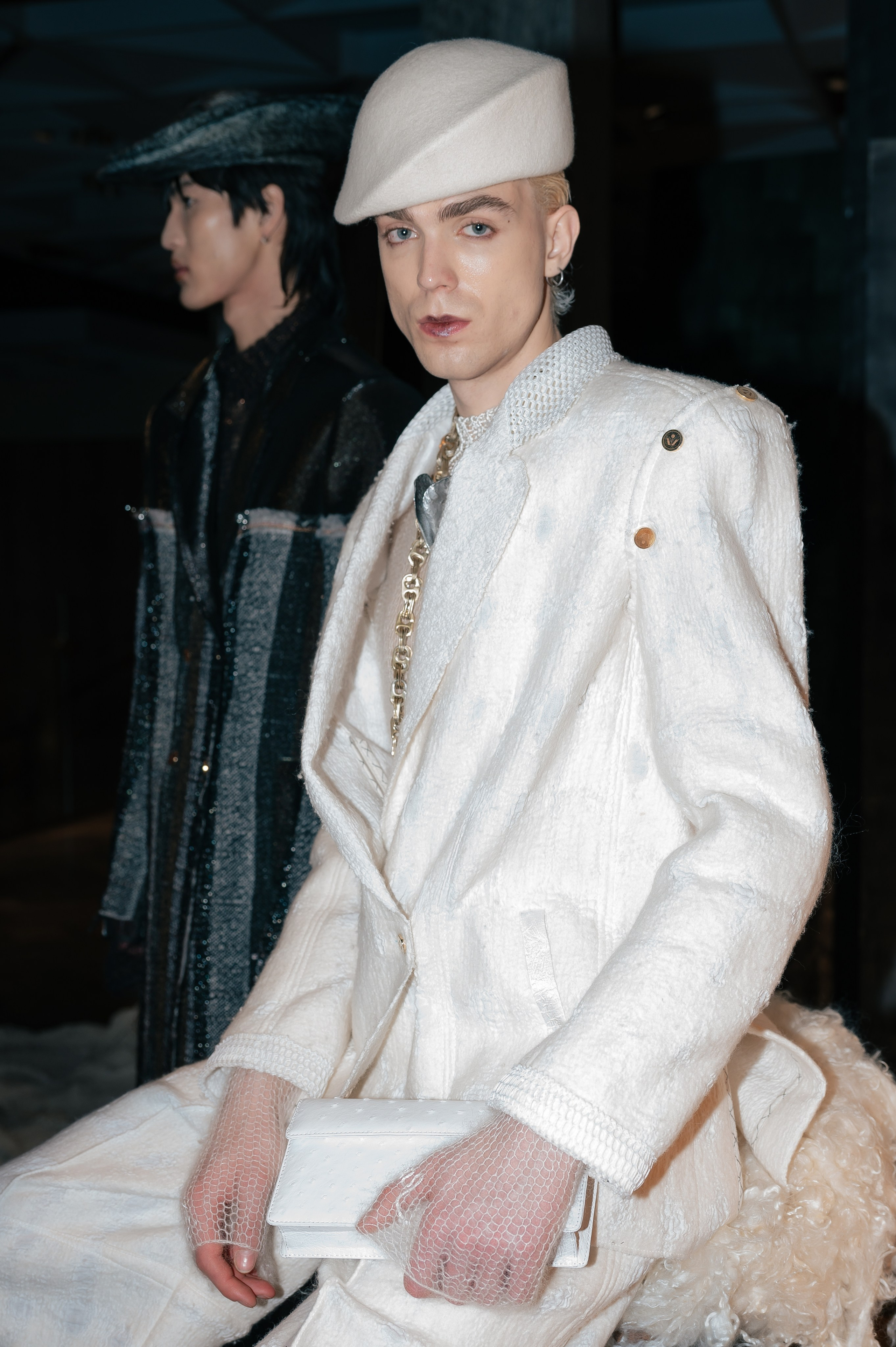 Models posing for reportage photographer at Vivier Presentation