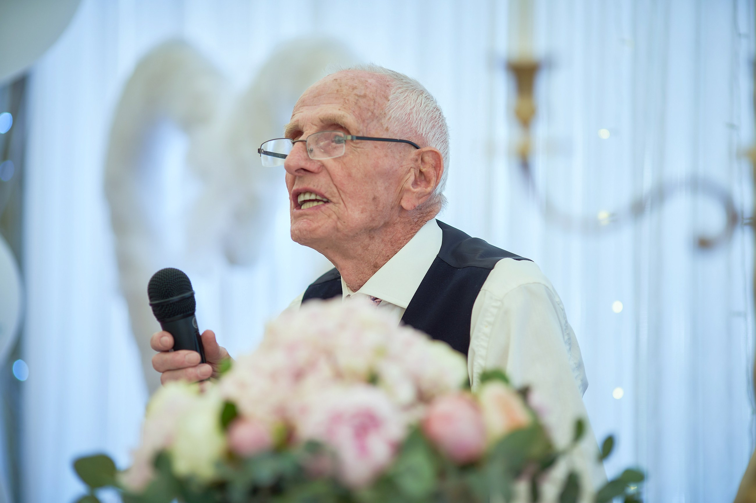 The Bride's grandfather gives a toast in her honor