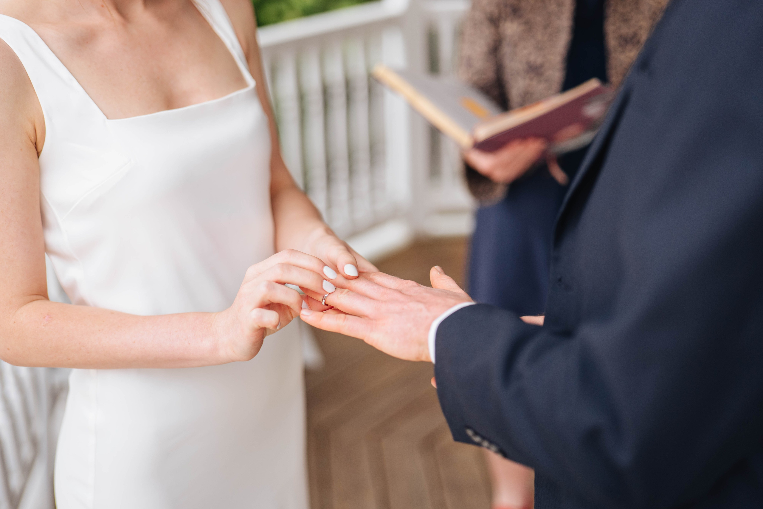 bride and groom at the ceremony, changing rings