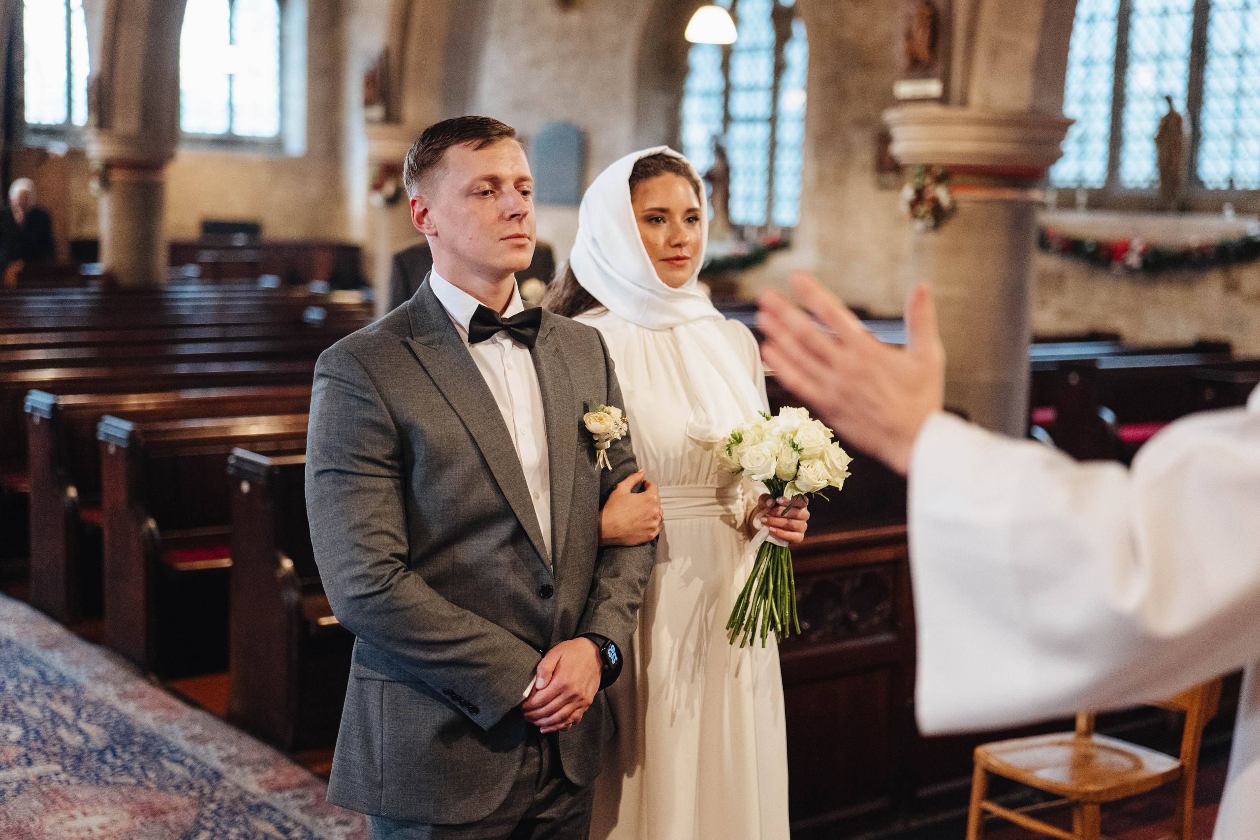 Couple standing in church in sidcup, london