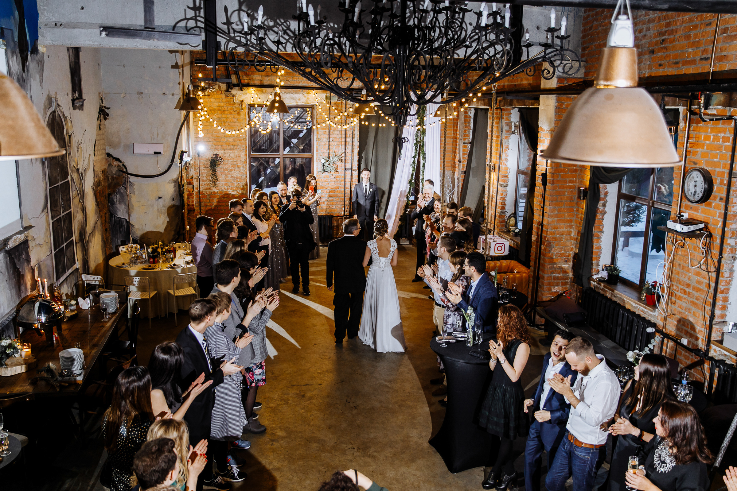 Bride walking down aisle in city venue, by Tanya Bogdan, Bude, Cornwall wedding photographer.  