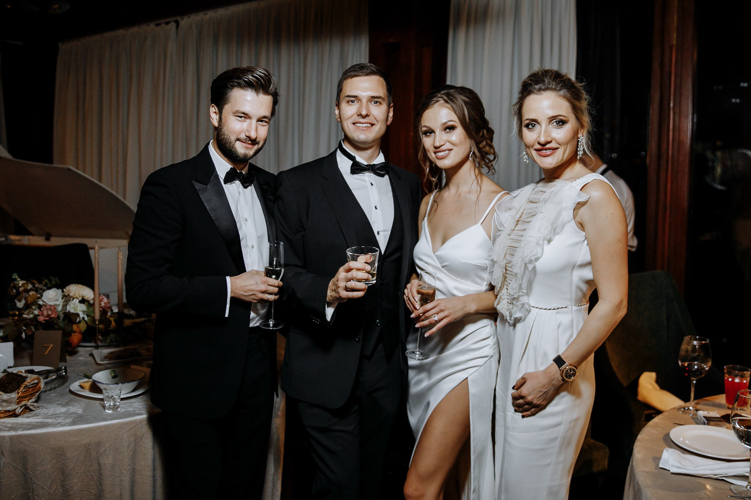 Couple’s portrait with family at reception, by Tanya Bodgan, Bude, Cornwall wedding photography.  