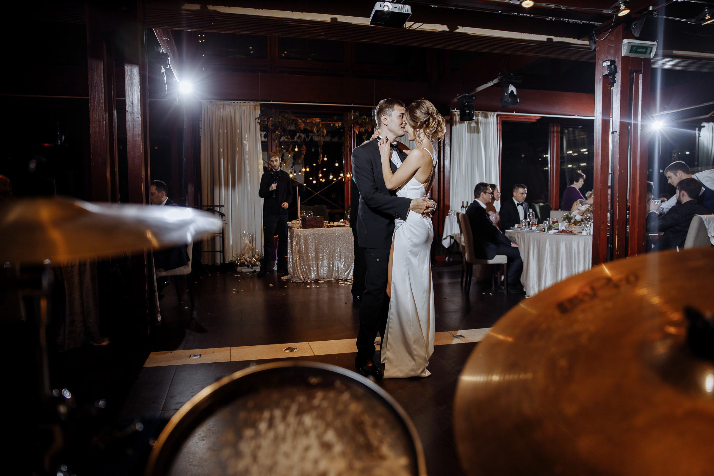 Couple’s dance floor embrace in hall, by Tanya Bodgan, Bude, Cornwall wedding photography.  