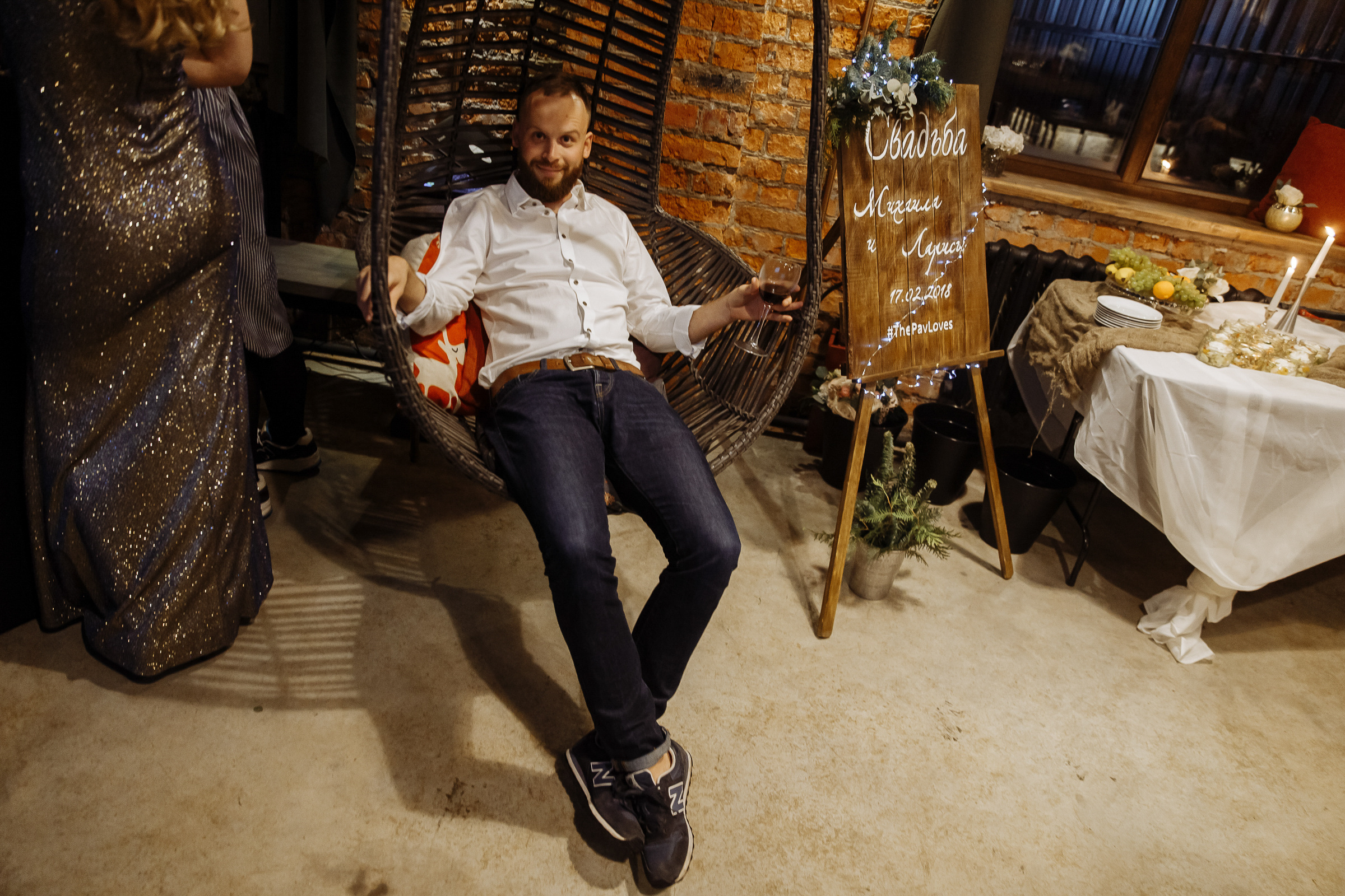 Guest sitting in city venue, by Tanya Bogdan, St Ives wedding photography.  