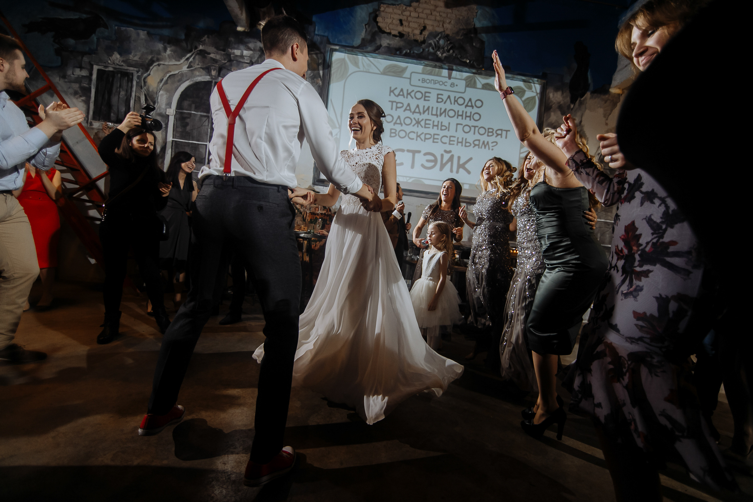 Couple’s dancefloor moment in hall, by Tanya Bogdan, London wedding photographer.  