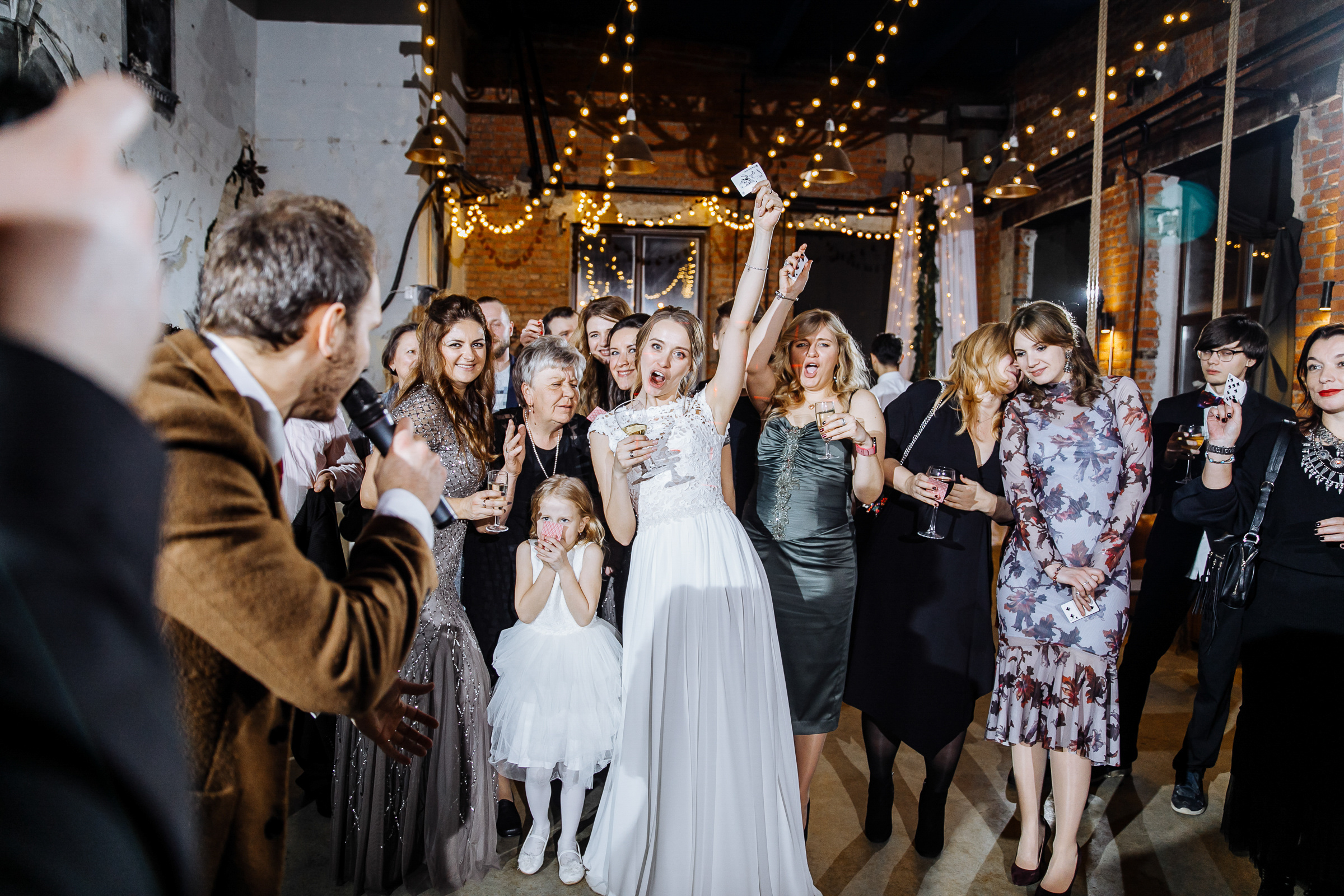 Bride cheering in city venue, by Tanya Bogdan, Devon wedding photography.  