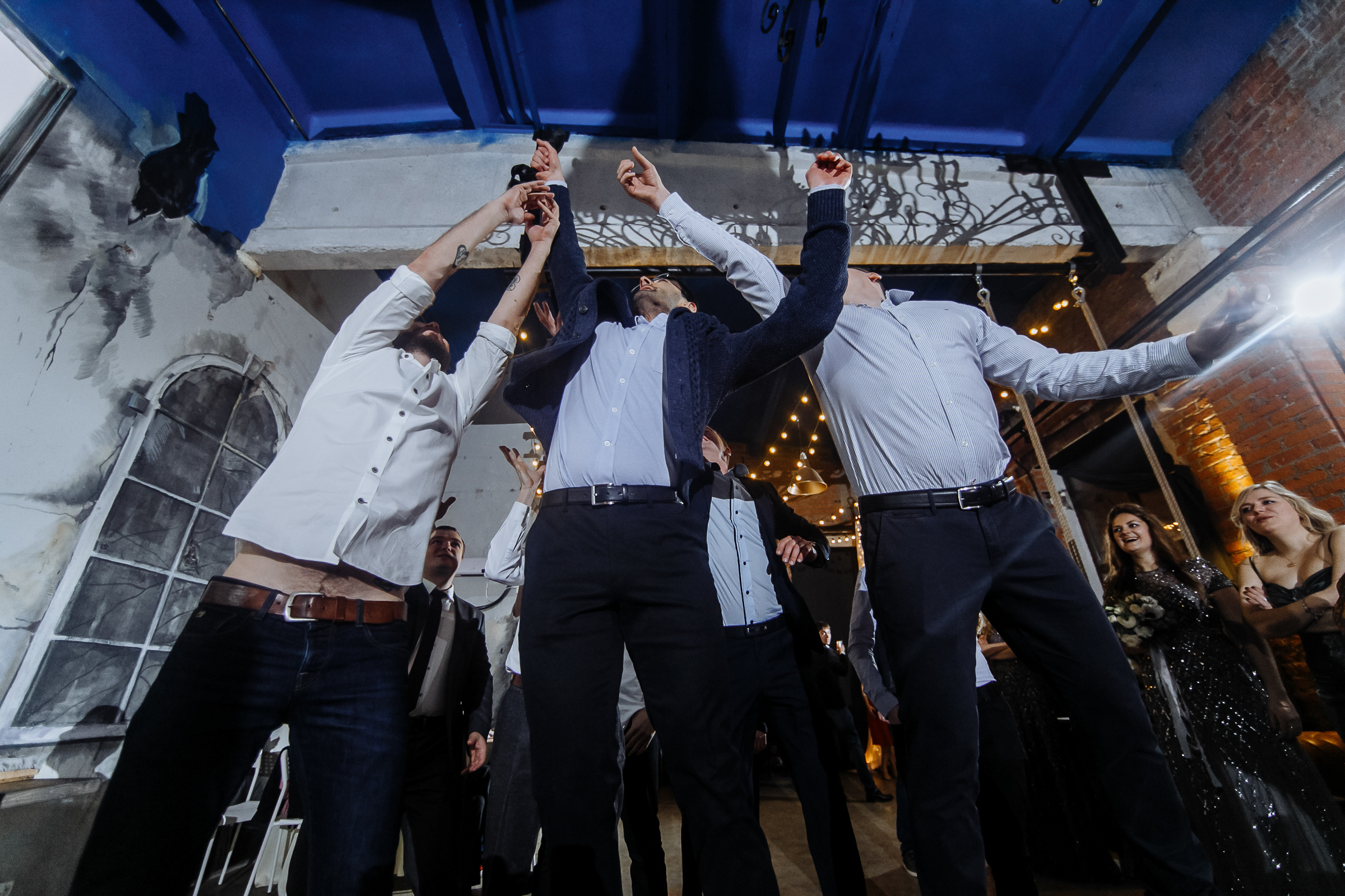 Tie catch in venue, by Tanya Bogdan, Bude, Cornwall wedding photographer.  