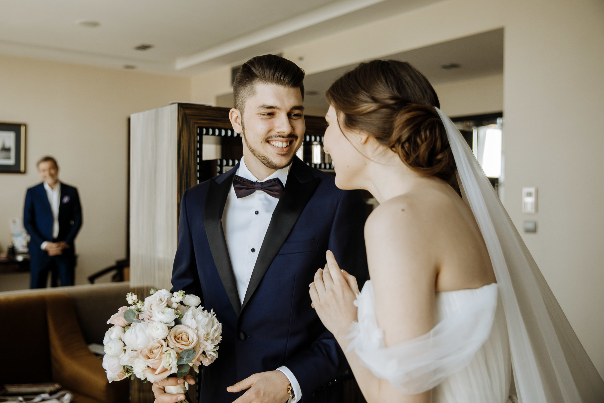 Bride and groom smile after first look, by Tanya Bogdan, Bude, Cornwall wedding photographer.  