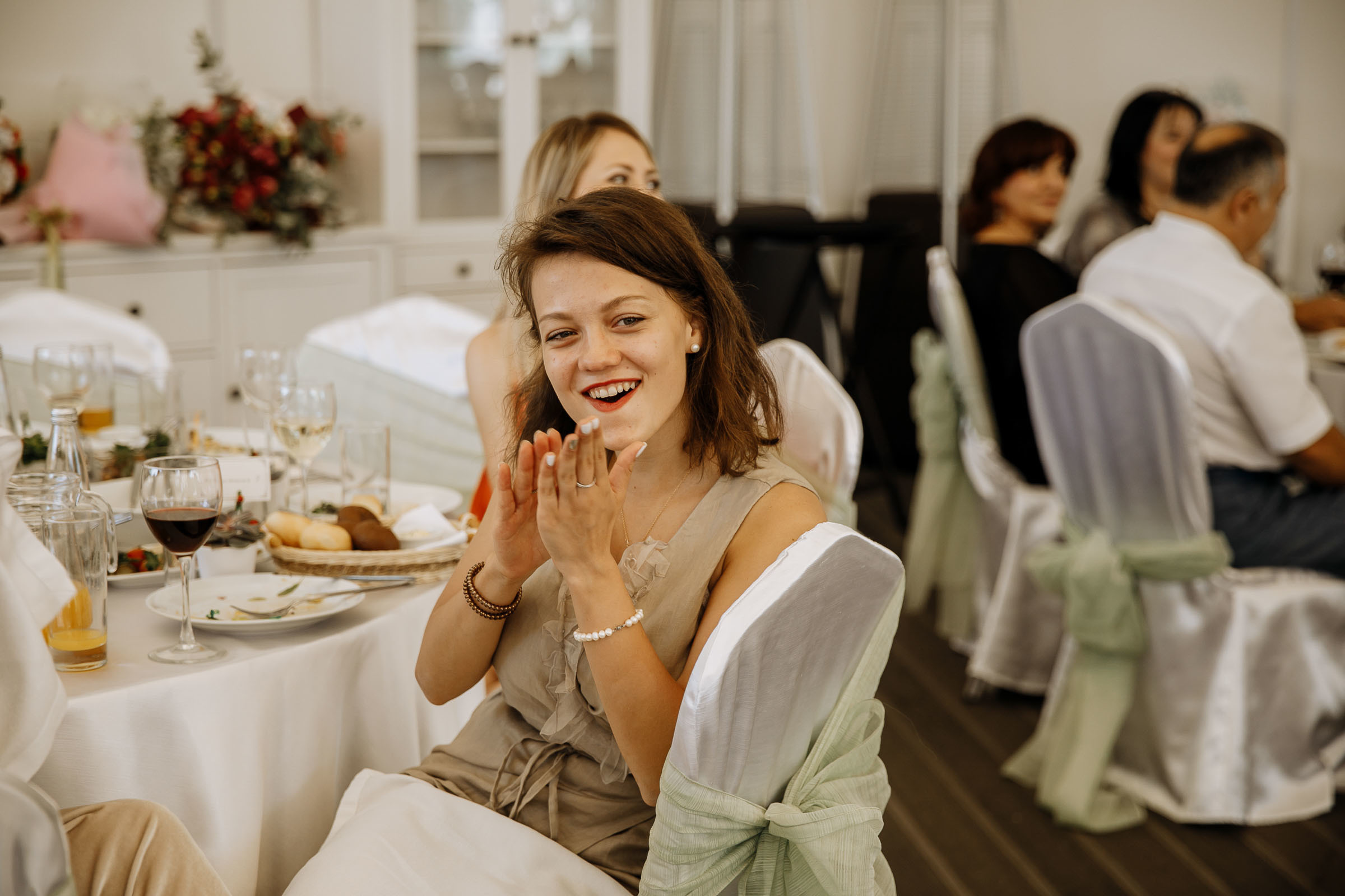 Guests cheering at entrance, by Tanya Bogdan, Bude, Cornwall wedding photographer.