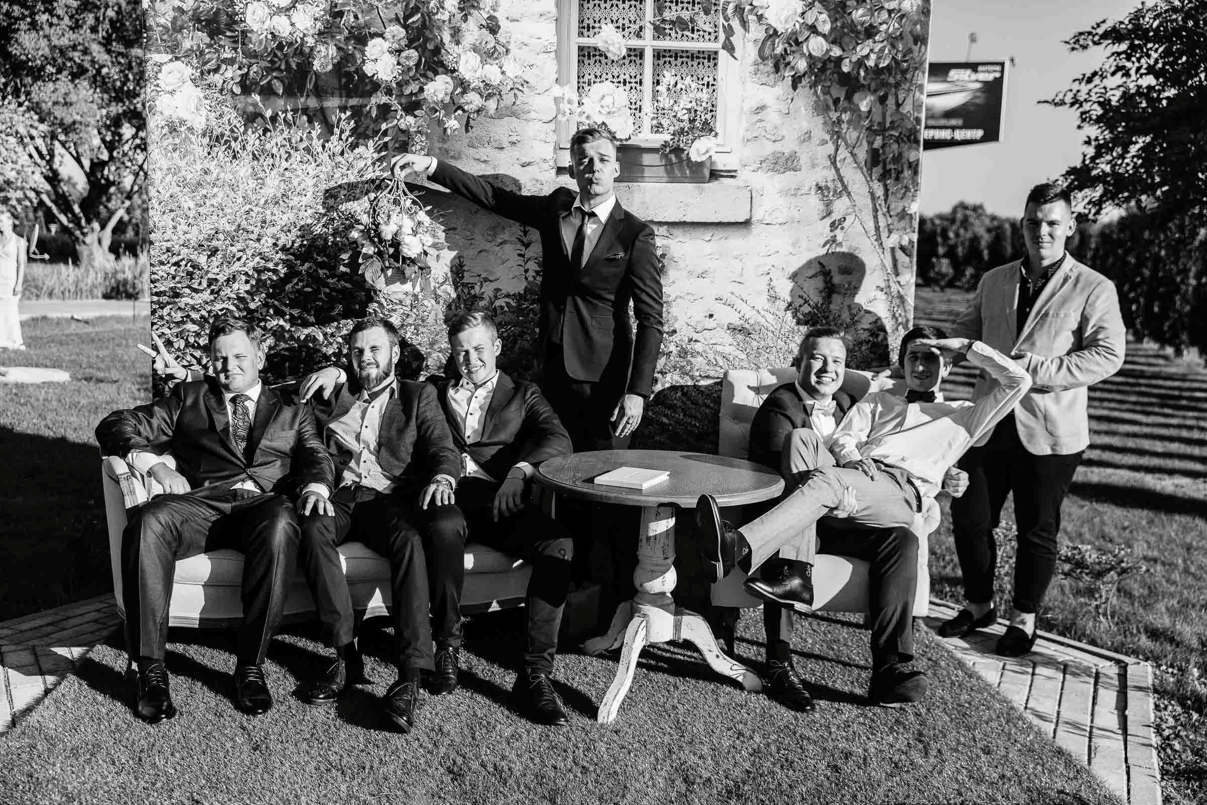 Group shot in front of house, by Tanya Bogdan, Bude wedding photographer.  