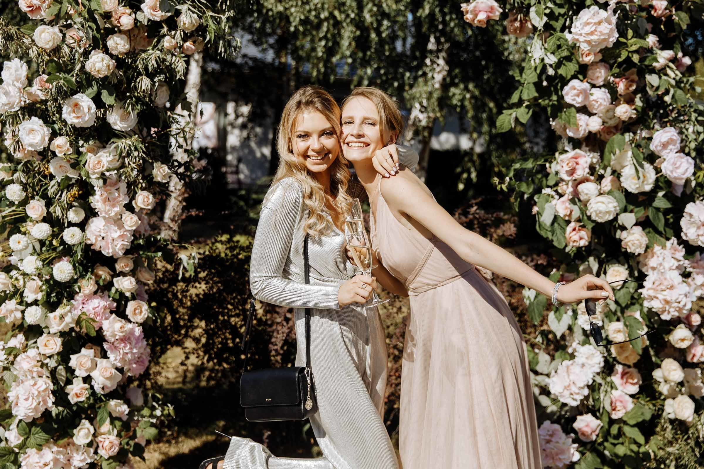 Guests laughing  in venue, by Tanya Bogdan, London wedding photographer.  