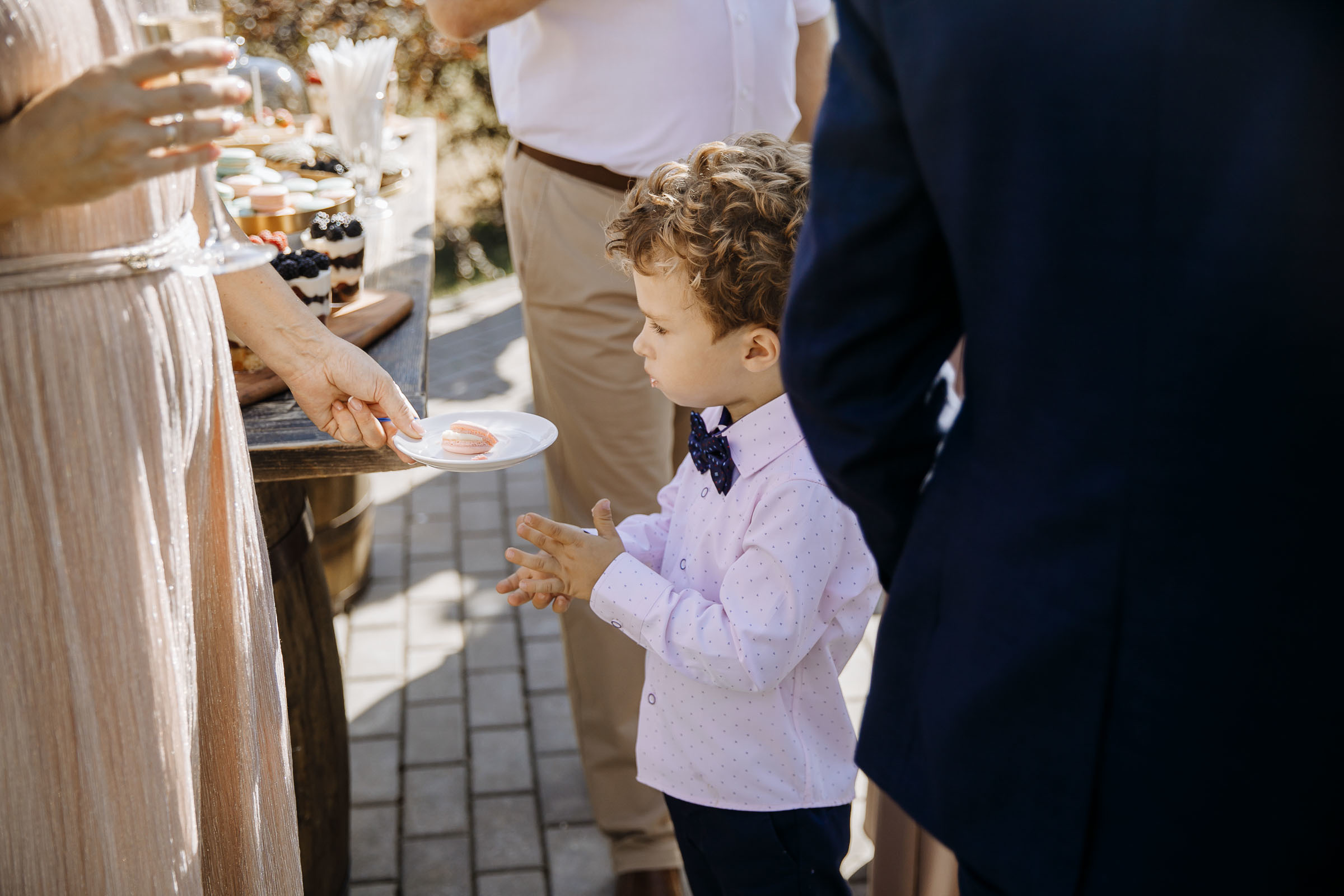 Page boy candid in garden, by Tanya Bogdan, Newquay wedding photography.  