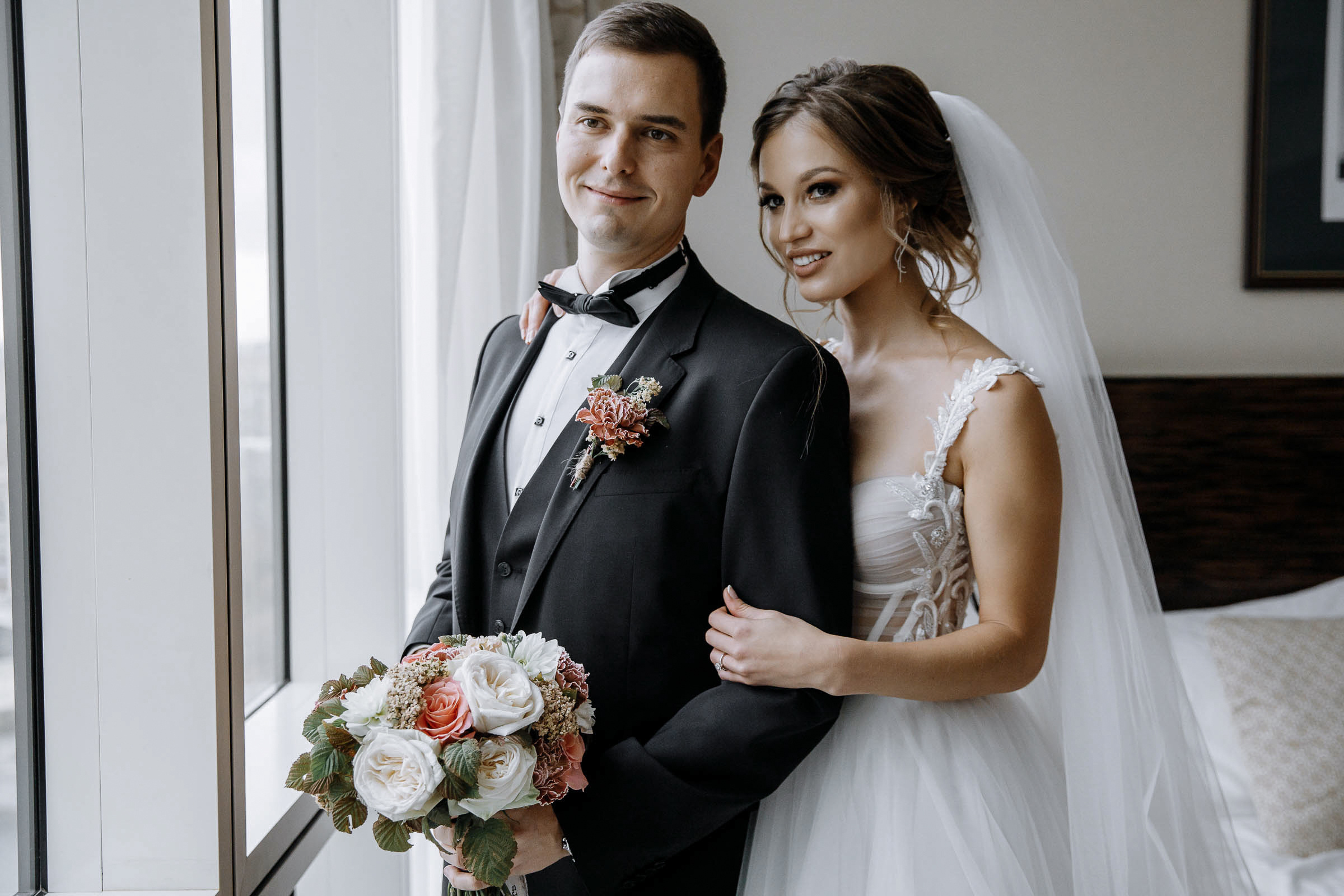 Bride and groom portrait by window, by Tanya Bodgan, Newquay wedding photography.  
