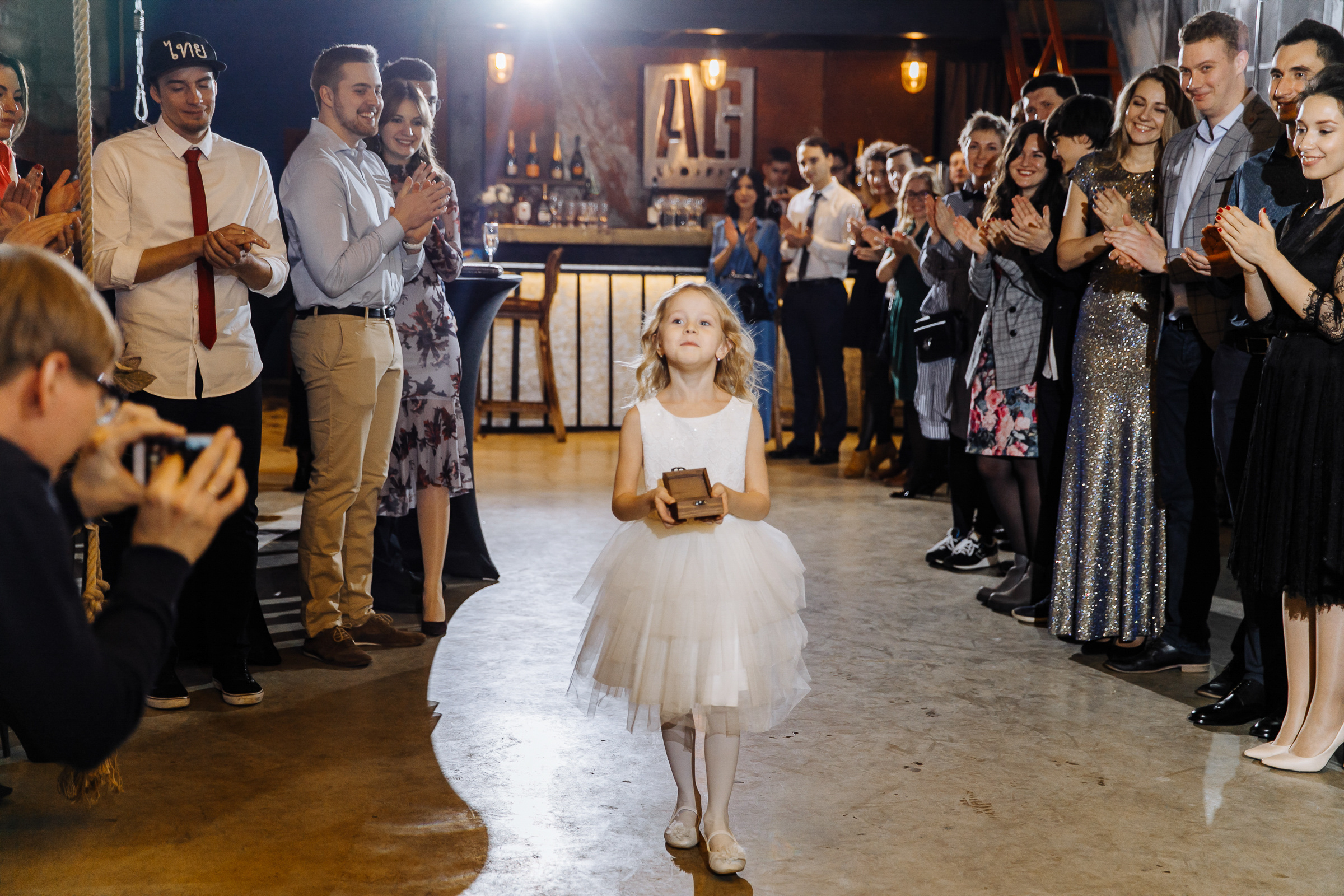 Floral girl entrance in city wedding venue, by Tanya Bogdan, Plymouth wedding photography.  