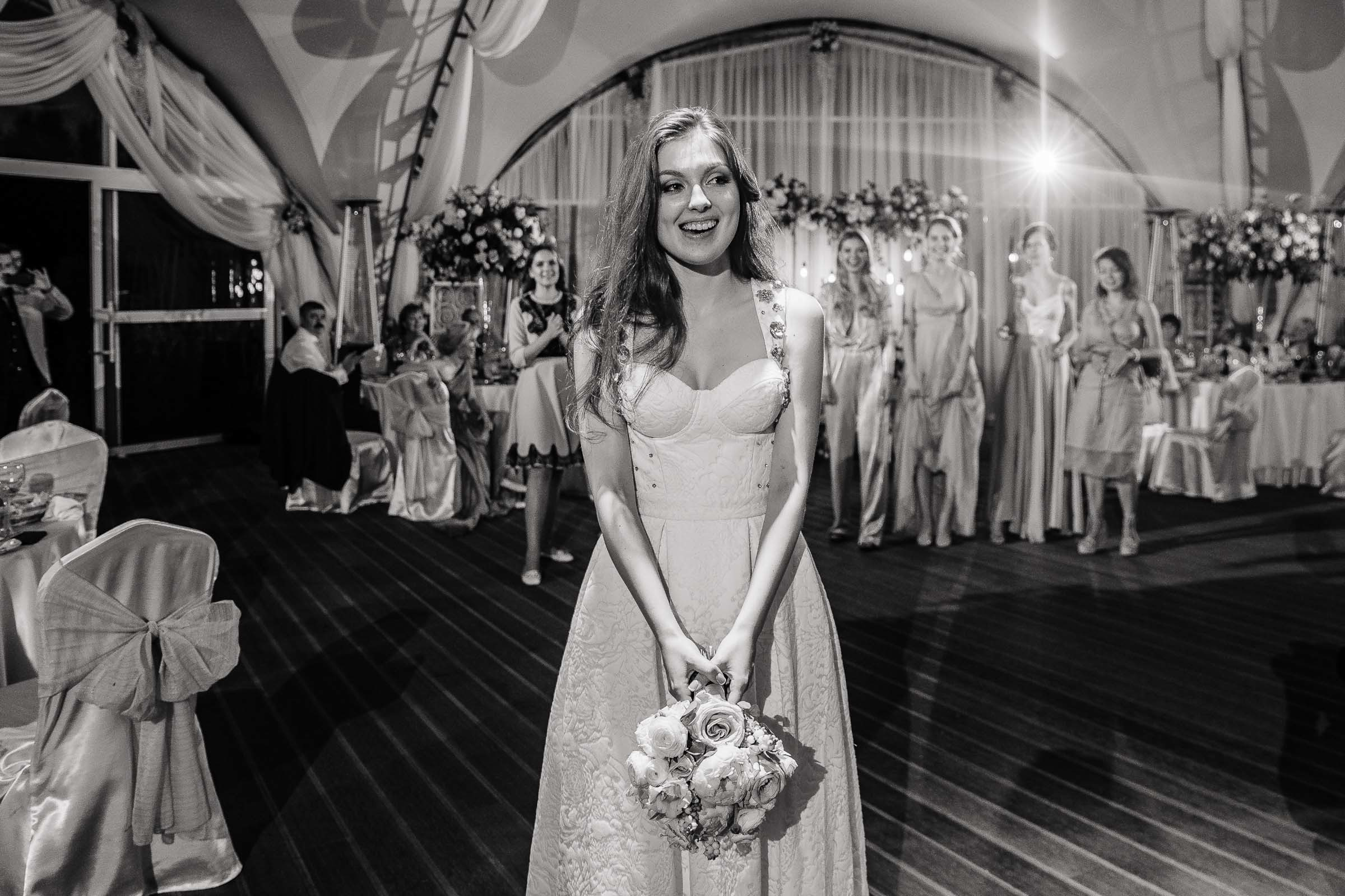 Bride tossing bouquet, by Tanya Bogdan, Plymouth wedding photography.  