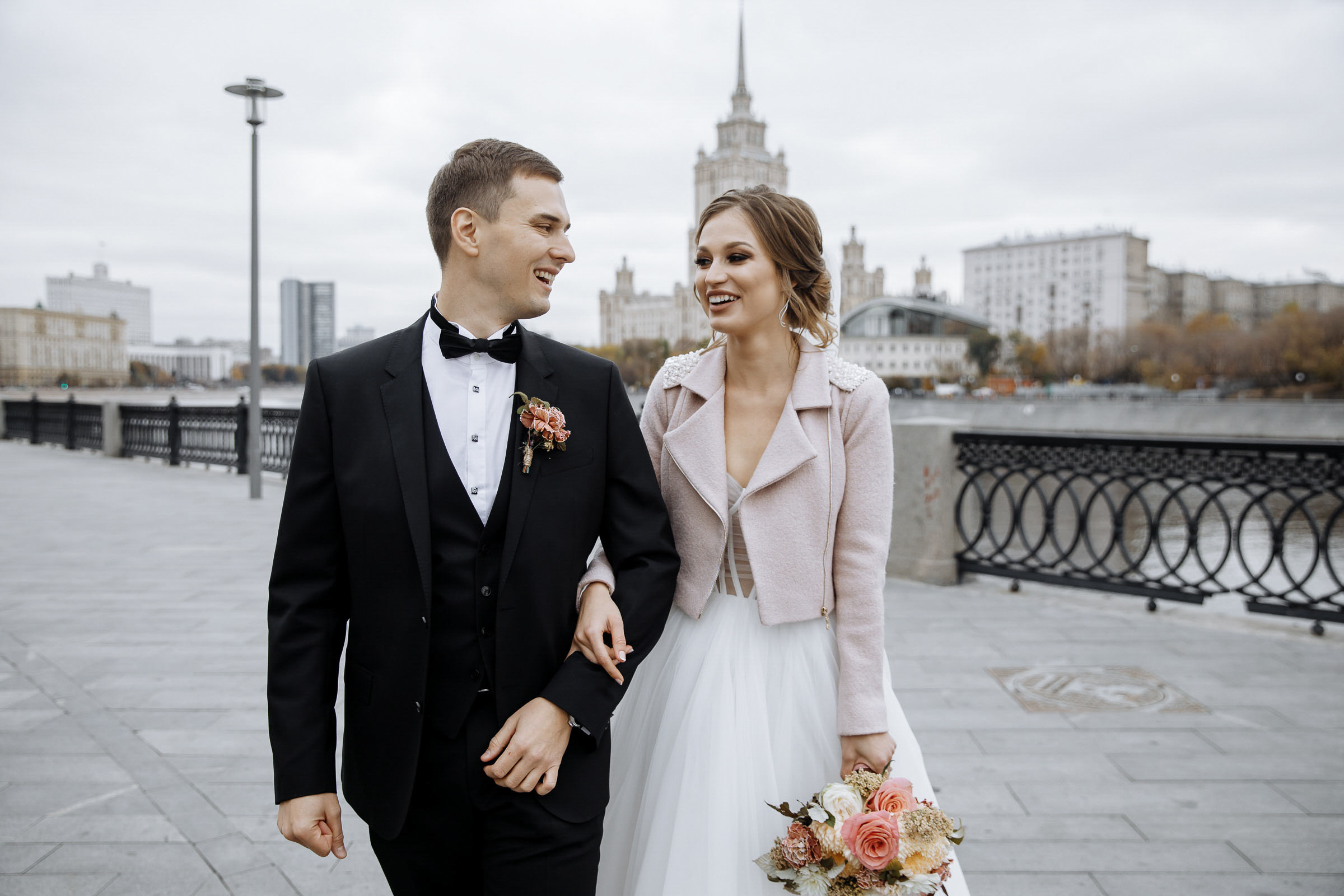 Bride and groom walking, by Tanya Bodgan, Cornwall wedding photography.  