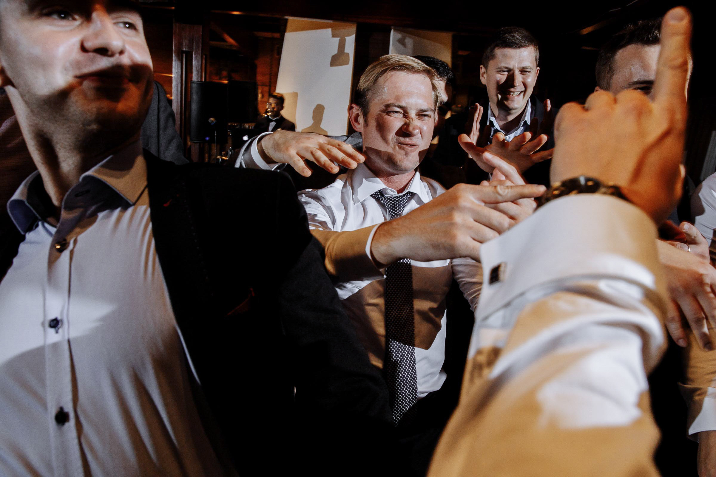 Getting ready for the garter by Tanya Bodgan, Cornwall wedding photographer.  