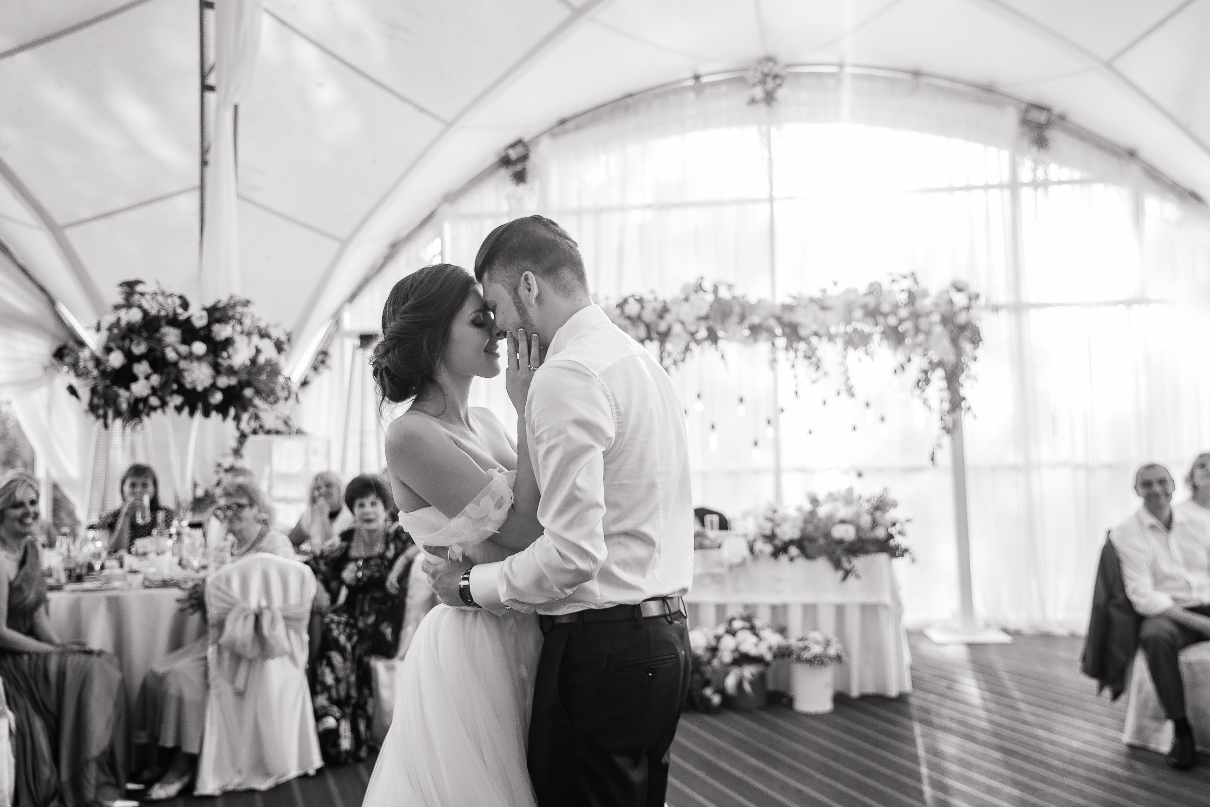 Couple’s embrace in black and white, by Tanya Bogdan, Bude, Cornwall wedding photographer.  