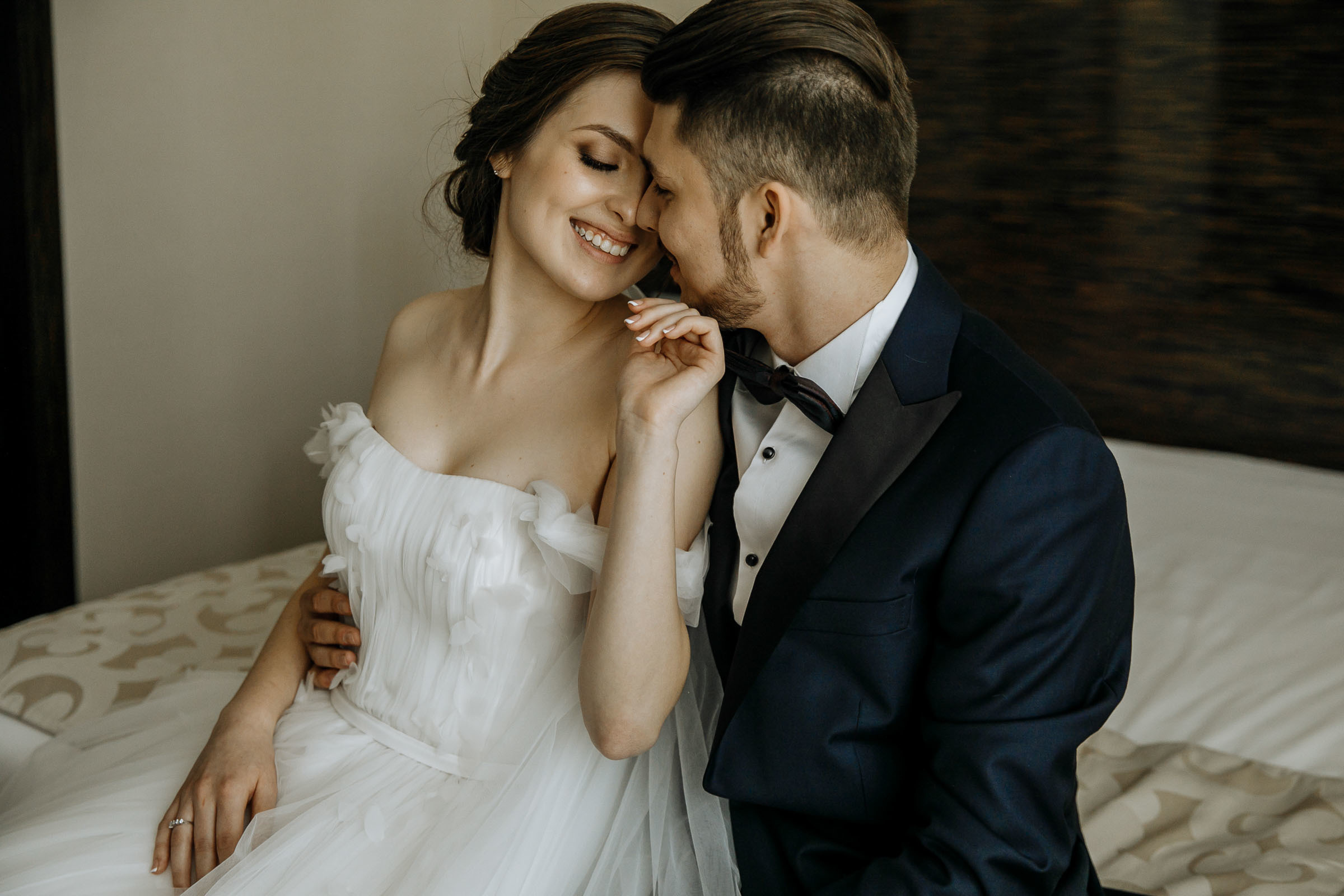 Couple’s pre-ceremony candid in venue, by Tanya Bogdan, Truro editorial wedding photographer.  