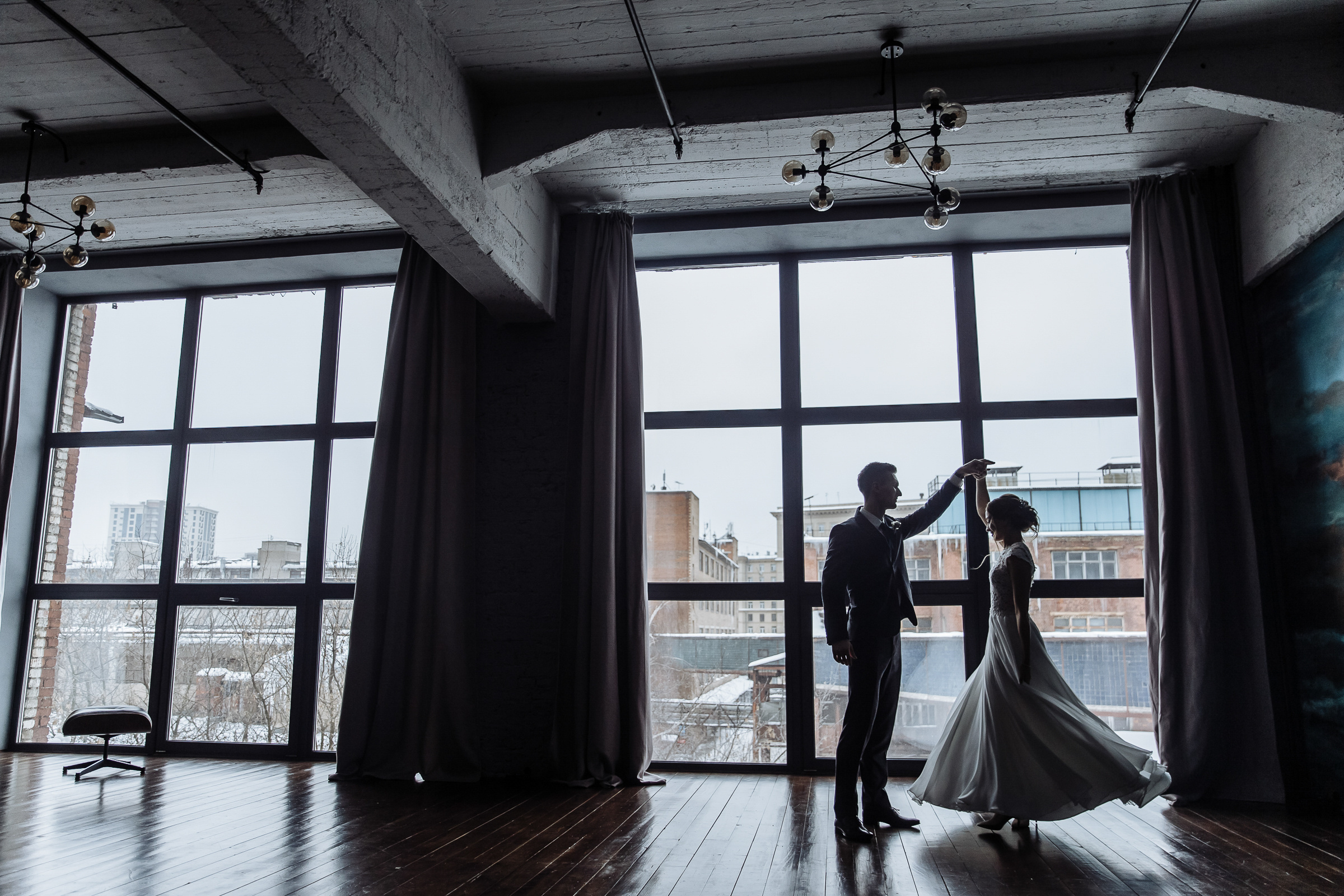 Couple’s studio portrait by window, by Tanya Bogdan, Bude wedding photographer.  