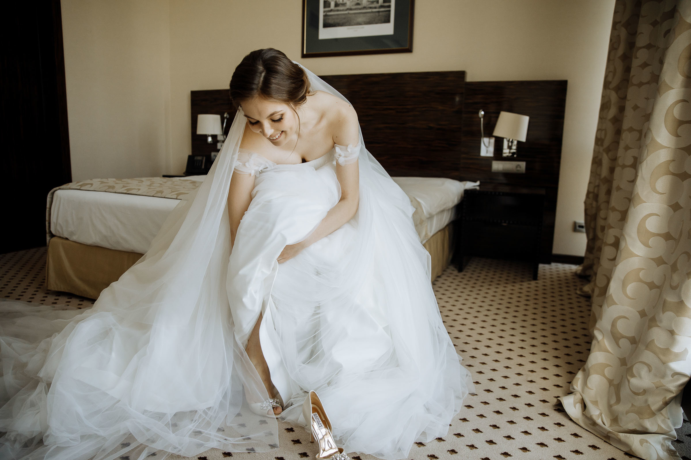 Bride putting on shoes, by Tanya Bogdan, Bude wedding photography.  