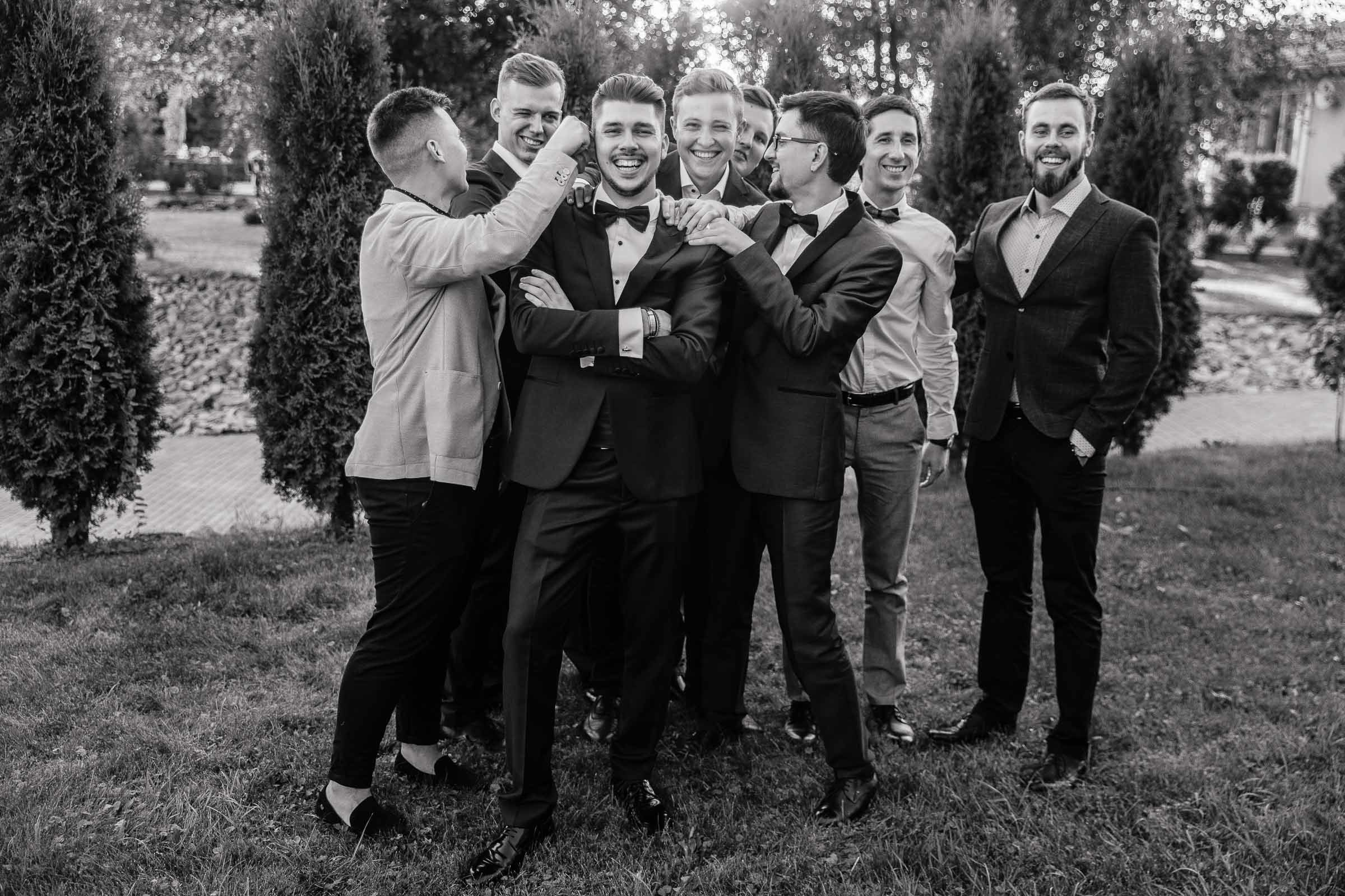 Groomsmen portrait with groom in garden venue, by Tanya Bogdan, Bude wedding photography.  