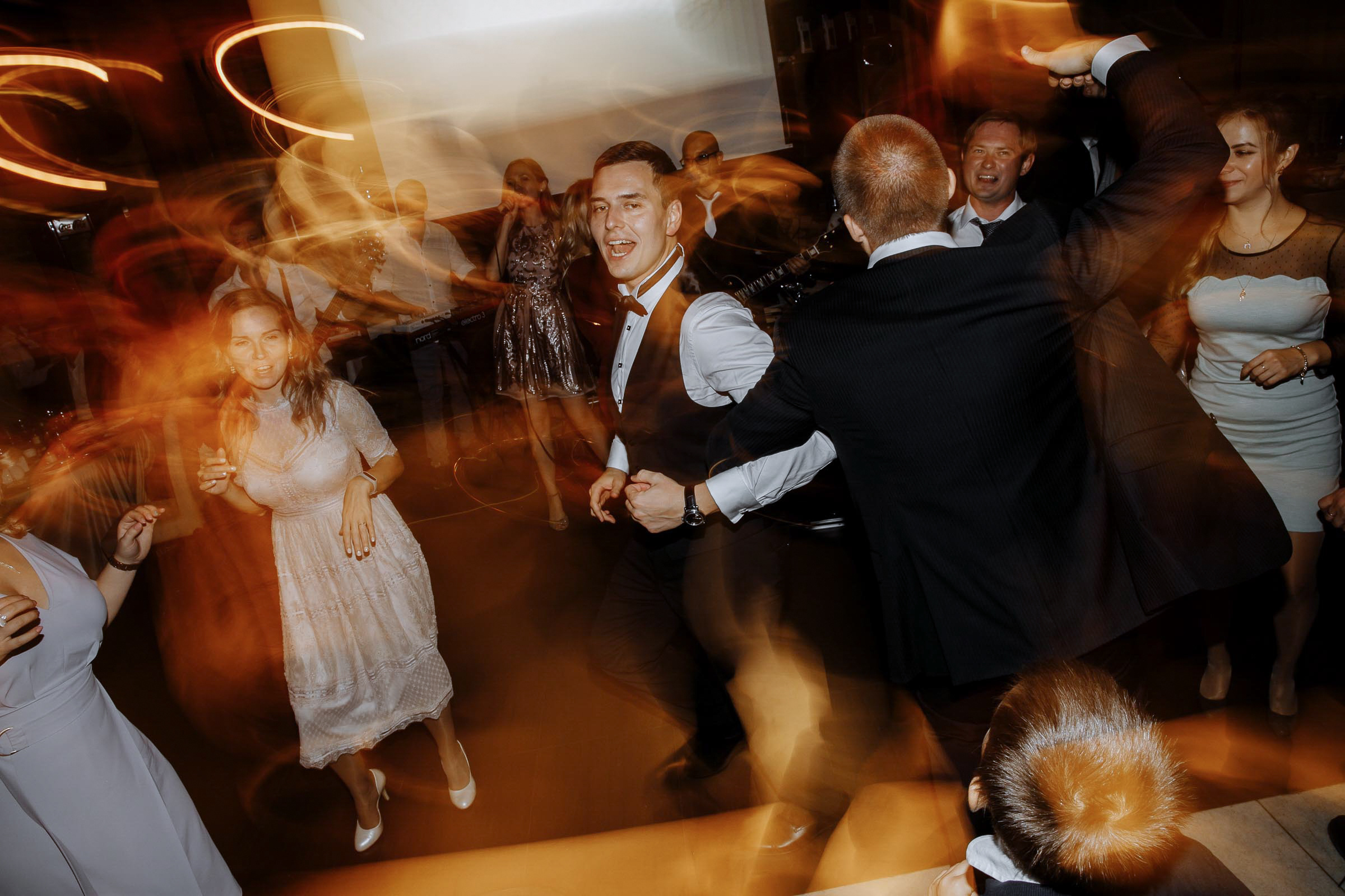 Groomsmen on dance floor in venue, by Tanya Bodgan, Newquay wedding photography.  