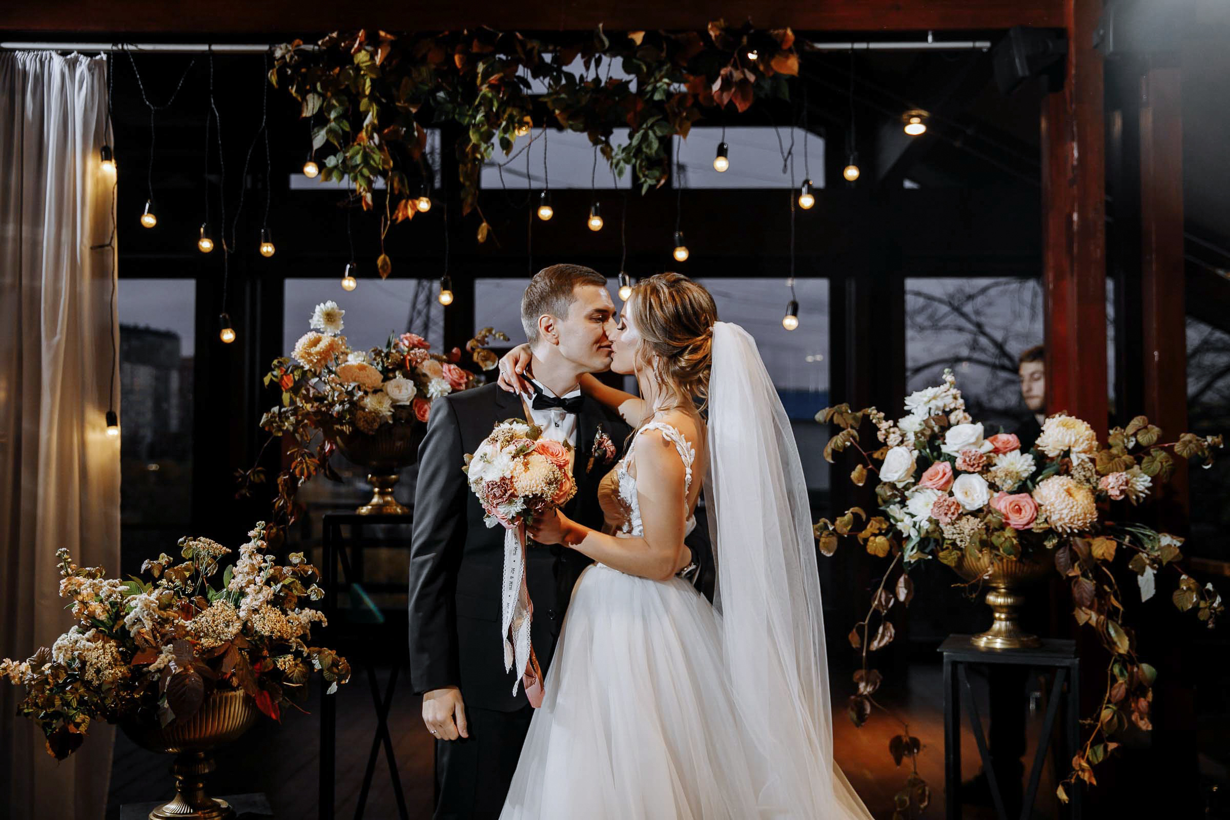 Couple’s ceremony embrace in venue, by Tanya Bodgan, Bude wedding photographer.