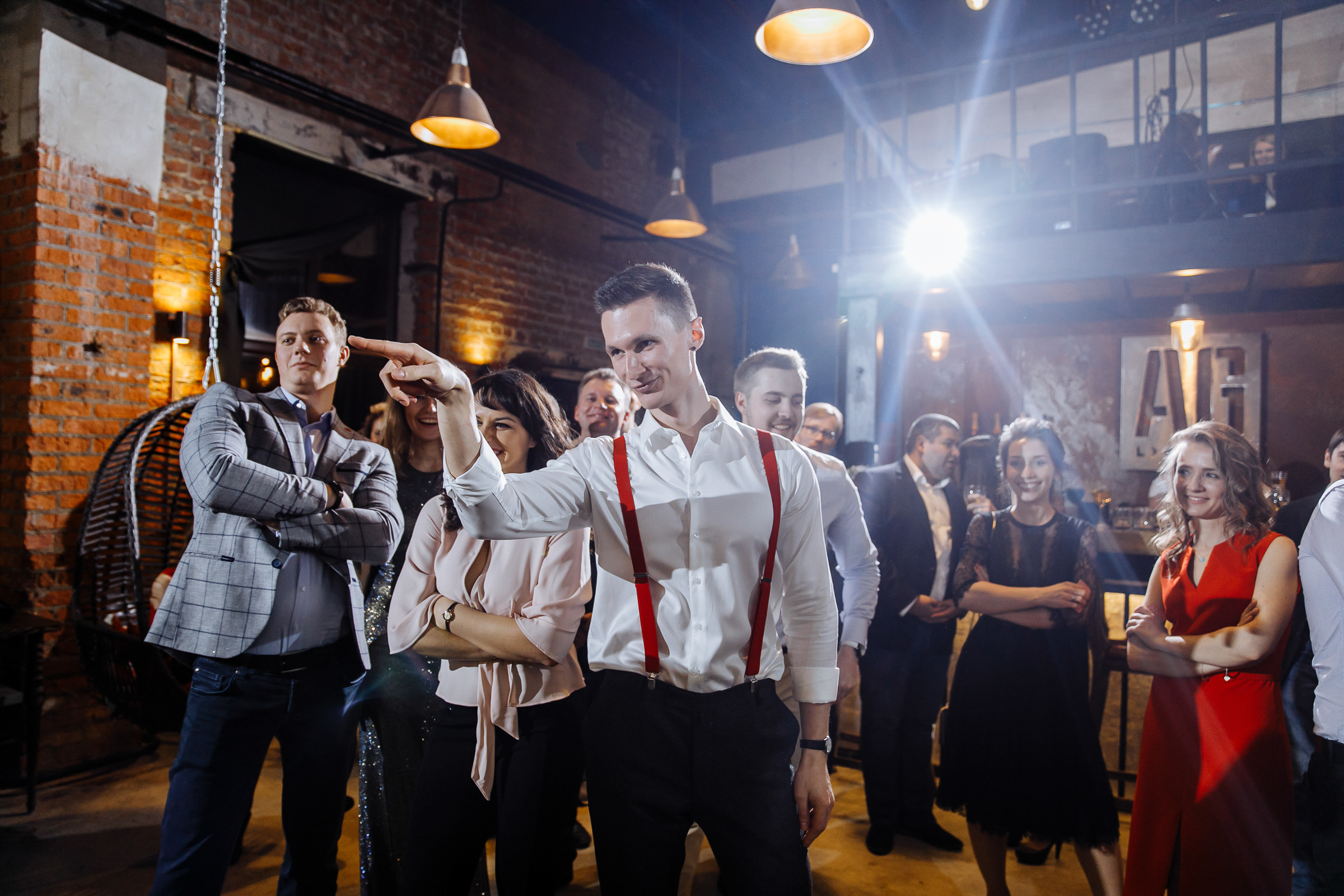 Groom's dancefloor moment in hall, by Tanya Bogdan, Bude wedding photographer.  