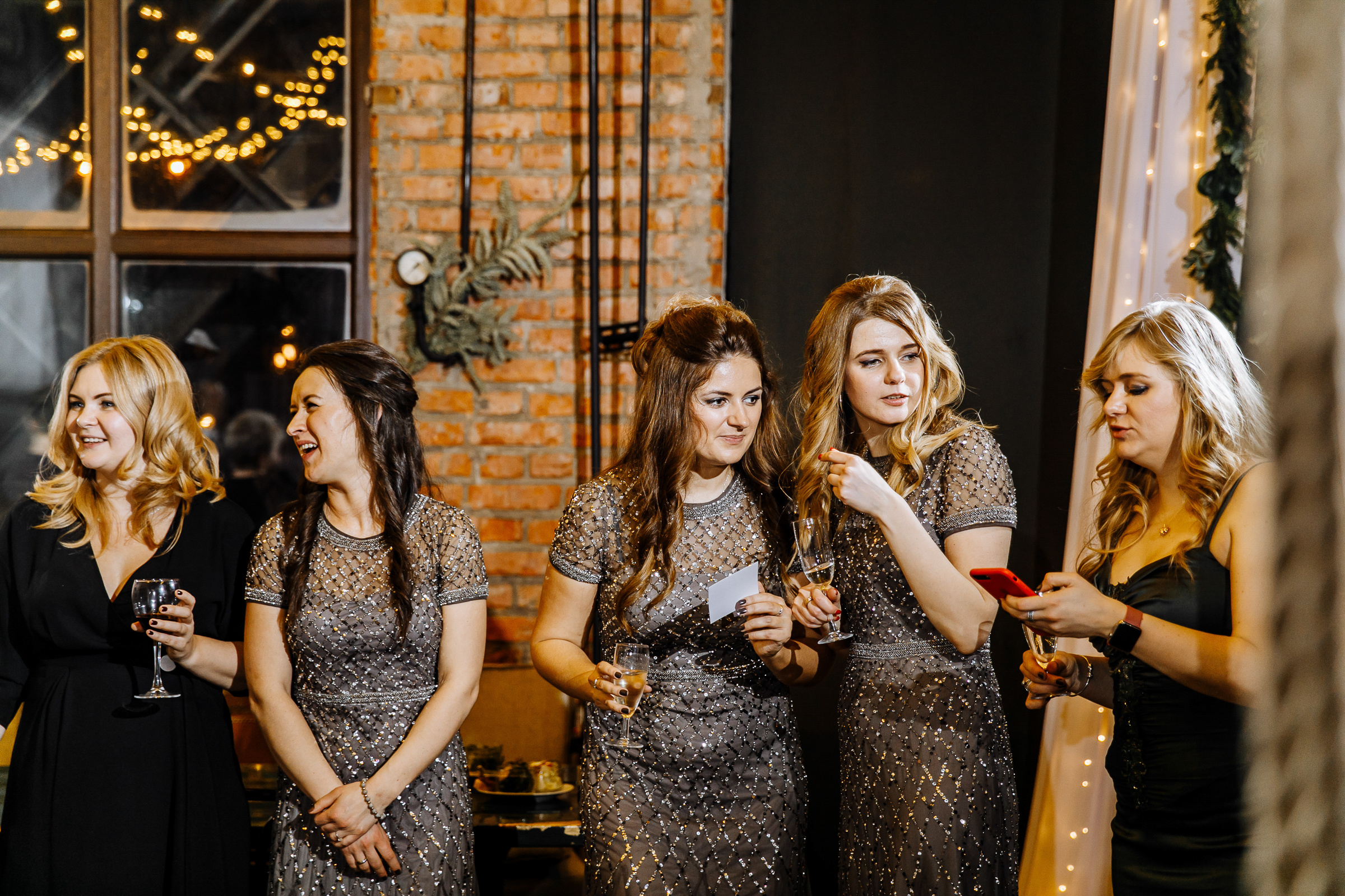 Bridesmaids candid during reception, by Tanya Bogdan, Truro wedding photographer