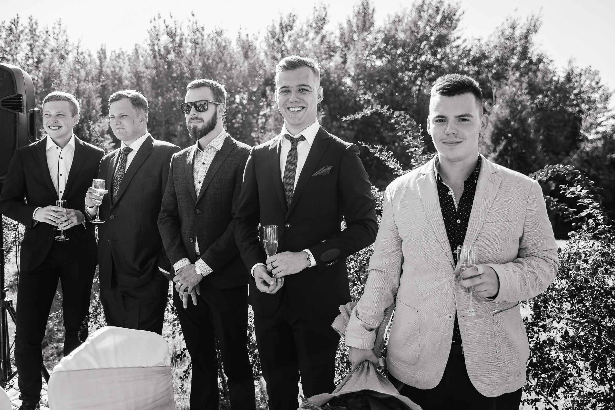 Groomsmen portrait in garden venue, by Tanya Bogdan, Bude wedding photography.  