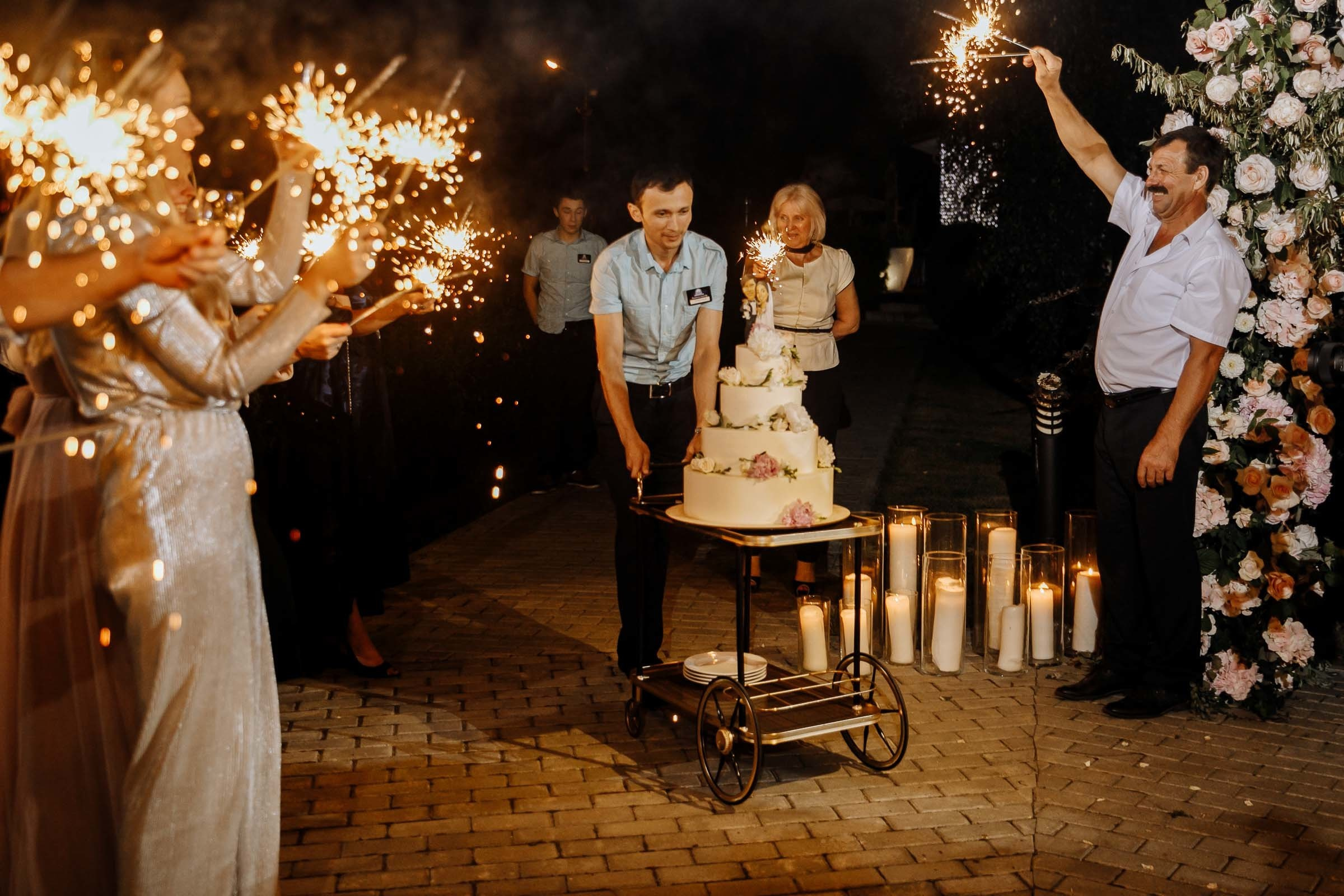 The cake is lit, by Tanya Bogdan, Bude editorial and reportage wedding photography.  