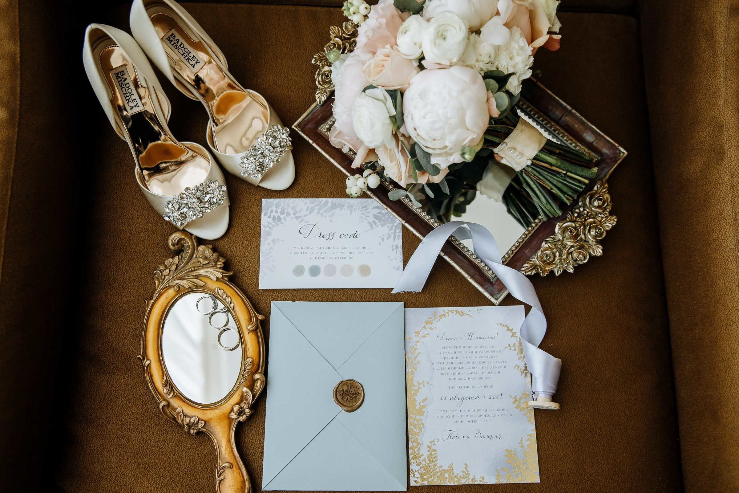 Bride’s shoes and details on wooden floor, by Tanya Bogdan, Truro editorial wedding photographer.  