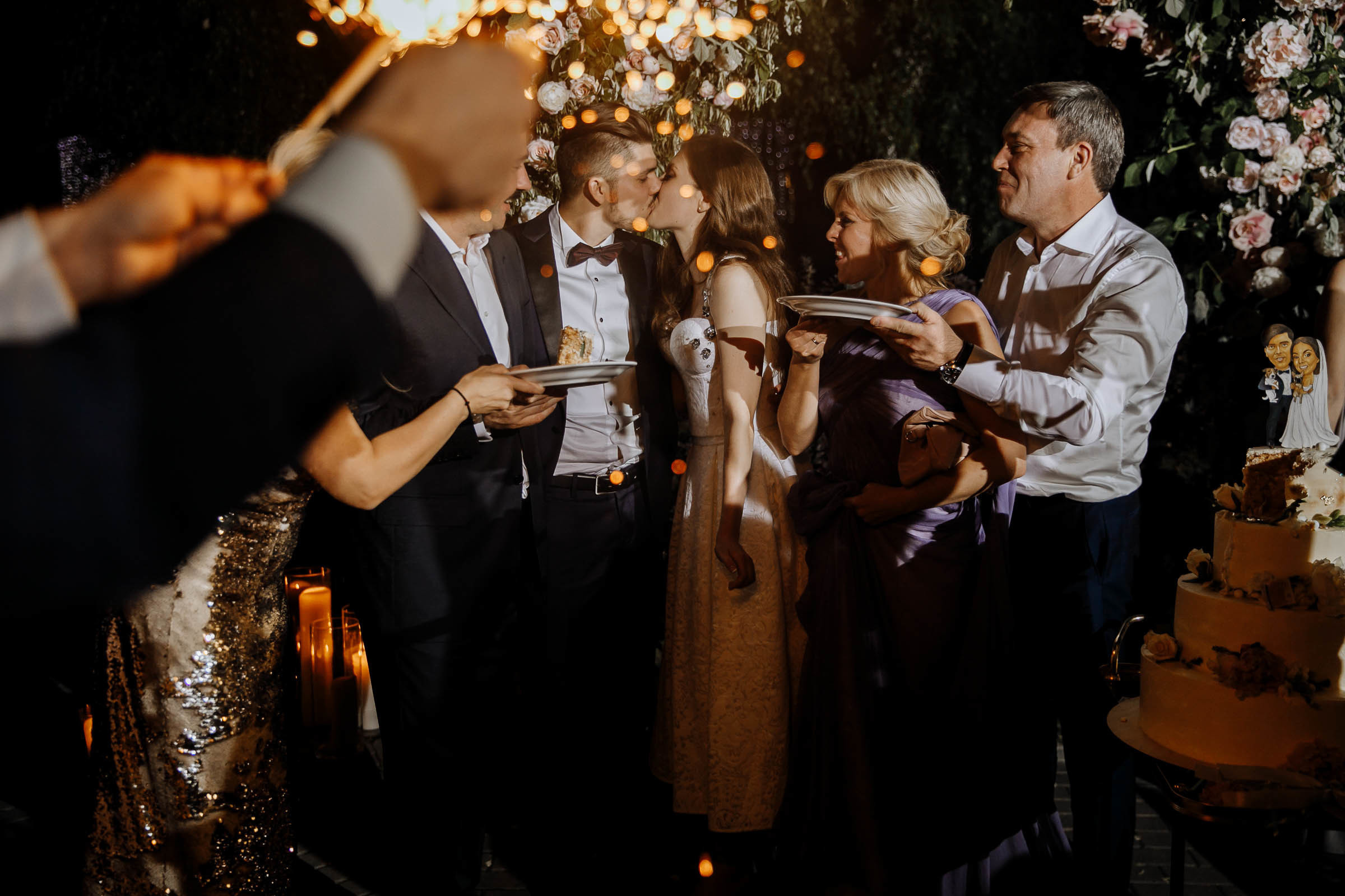 Guests eating cake, by Tanya Bogdan, Bude editorial and reportage wedding photography.  