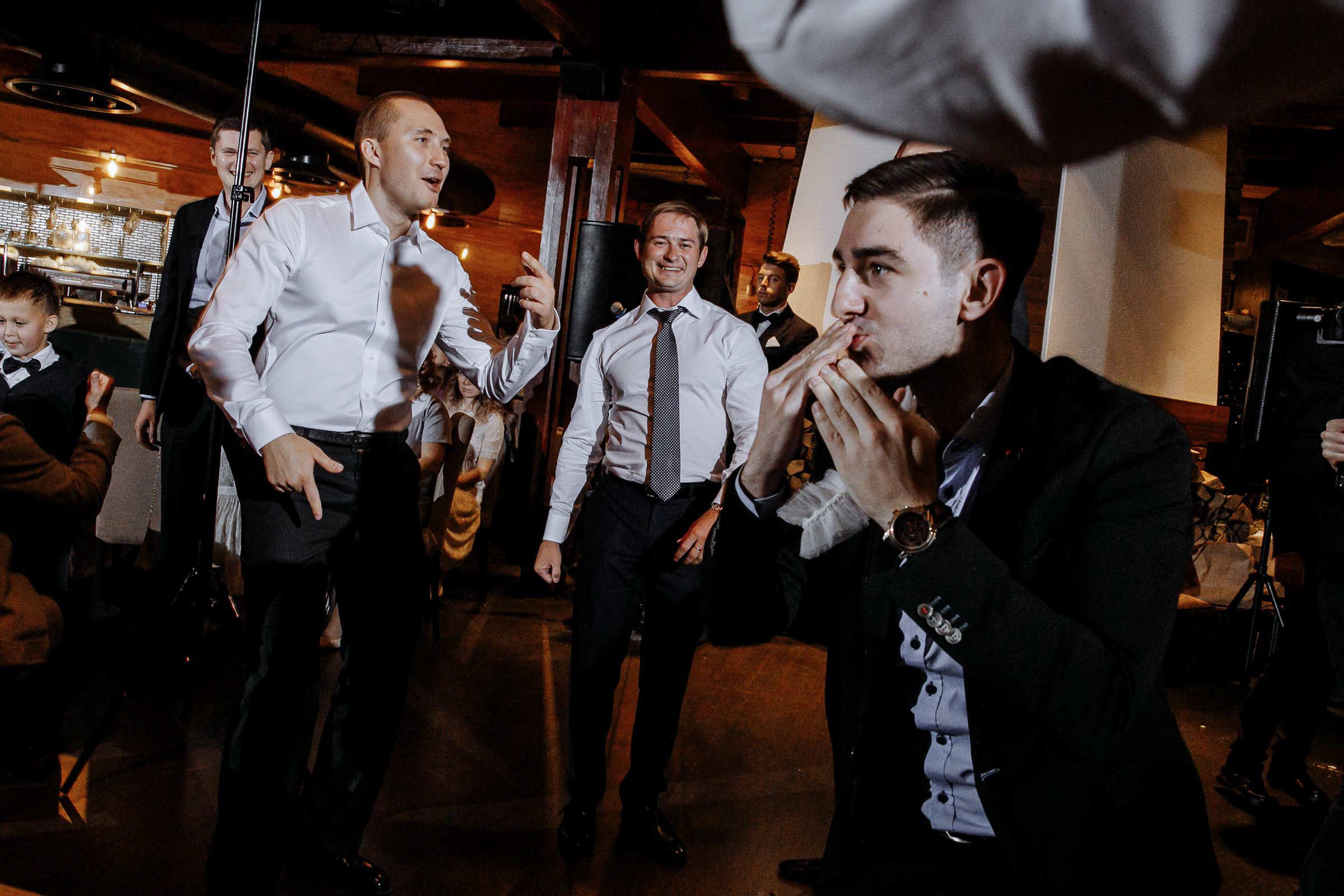 Catching the garter by Tanya Bodgan, Cornwall wedding photographer.  