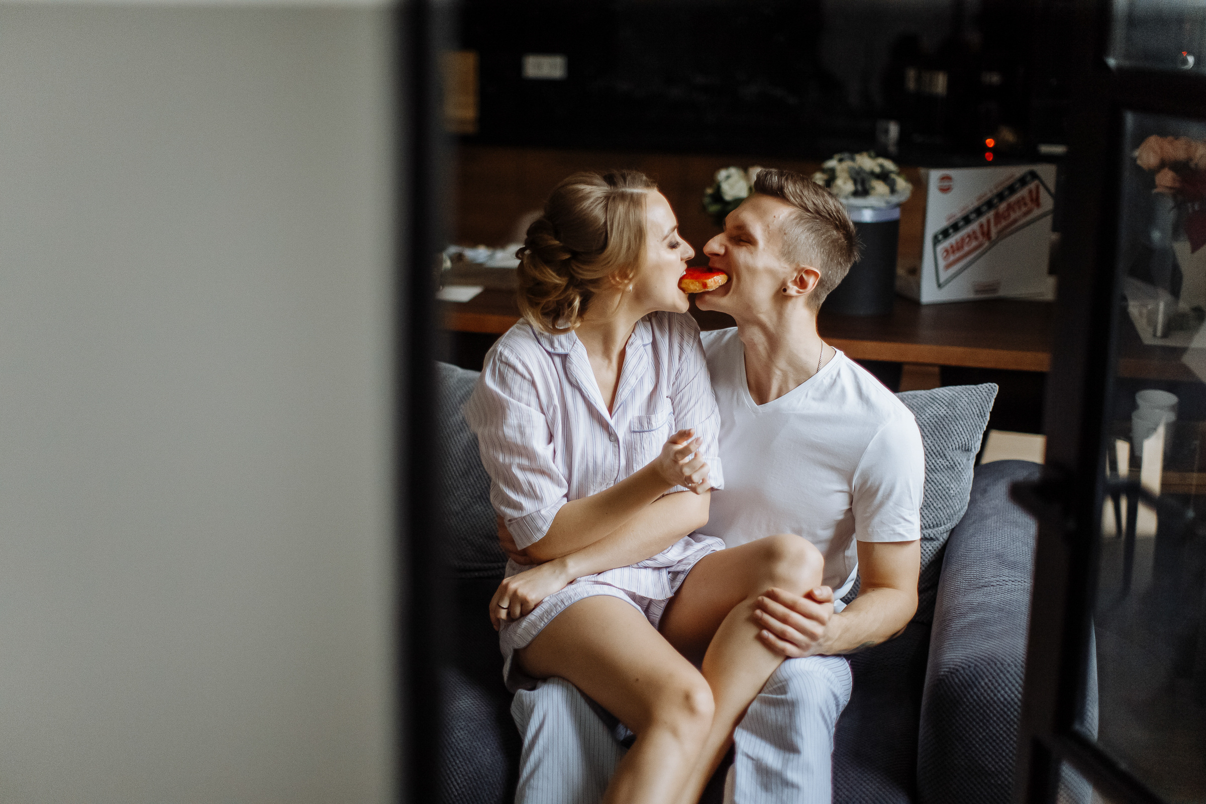Bride and groom breakfast in kitchen, by Tanya Bogdan, Bude, Cornwall wedding photographer.  