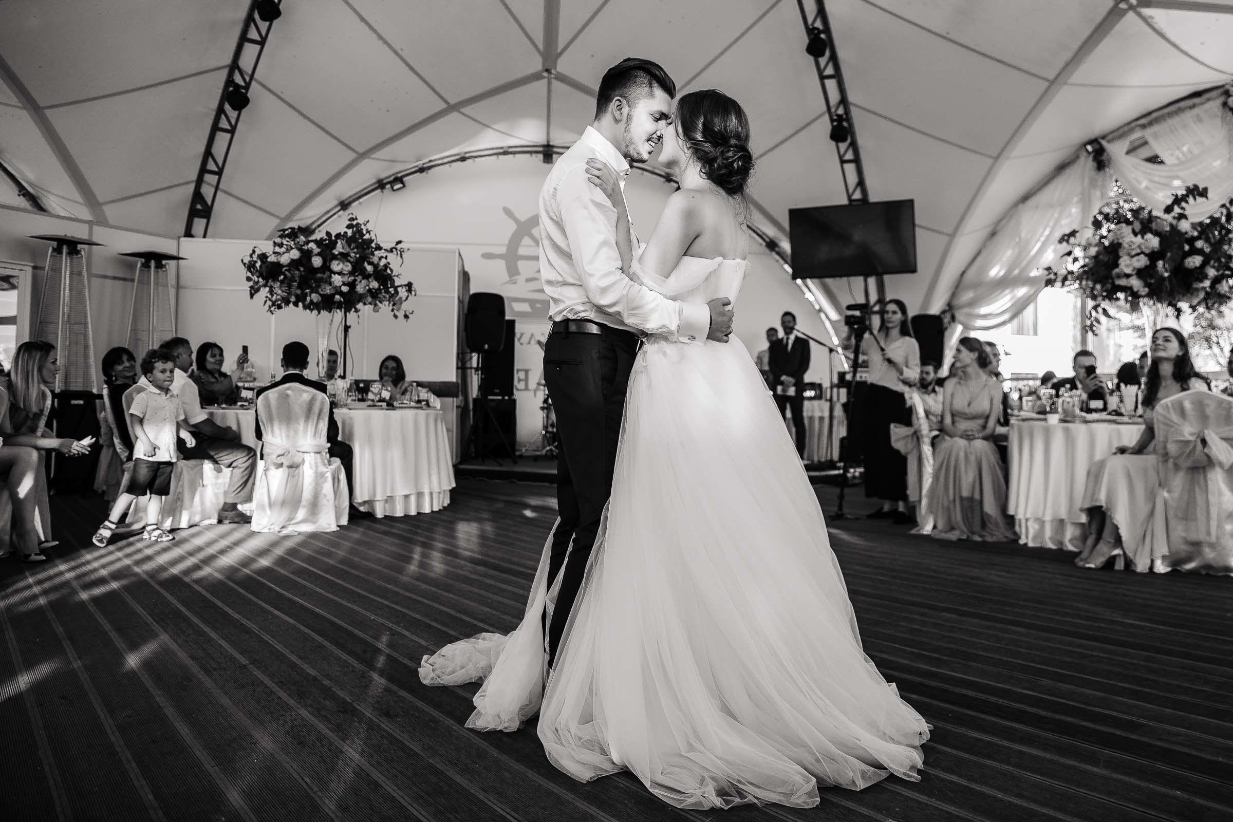 Couple’s first dance under marquee in black and white, by Tanya Bogdan, Bude, Cornwall wedding photographer.  