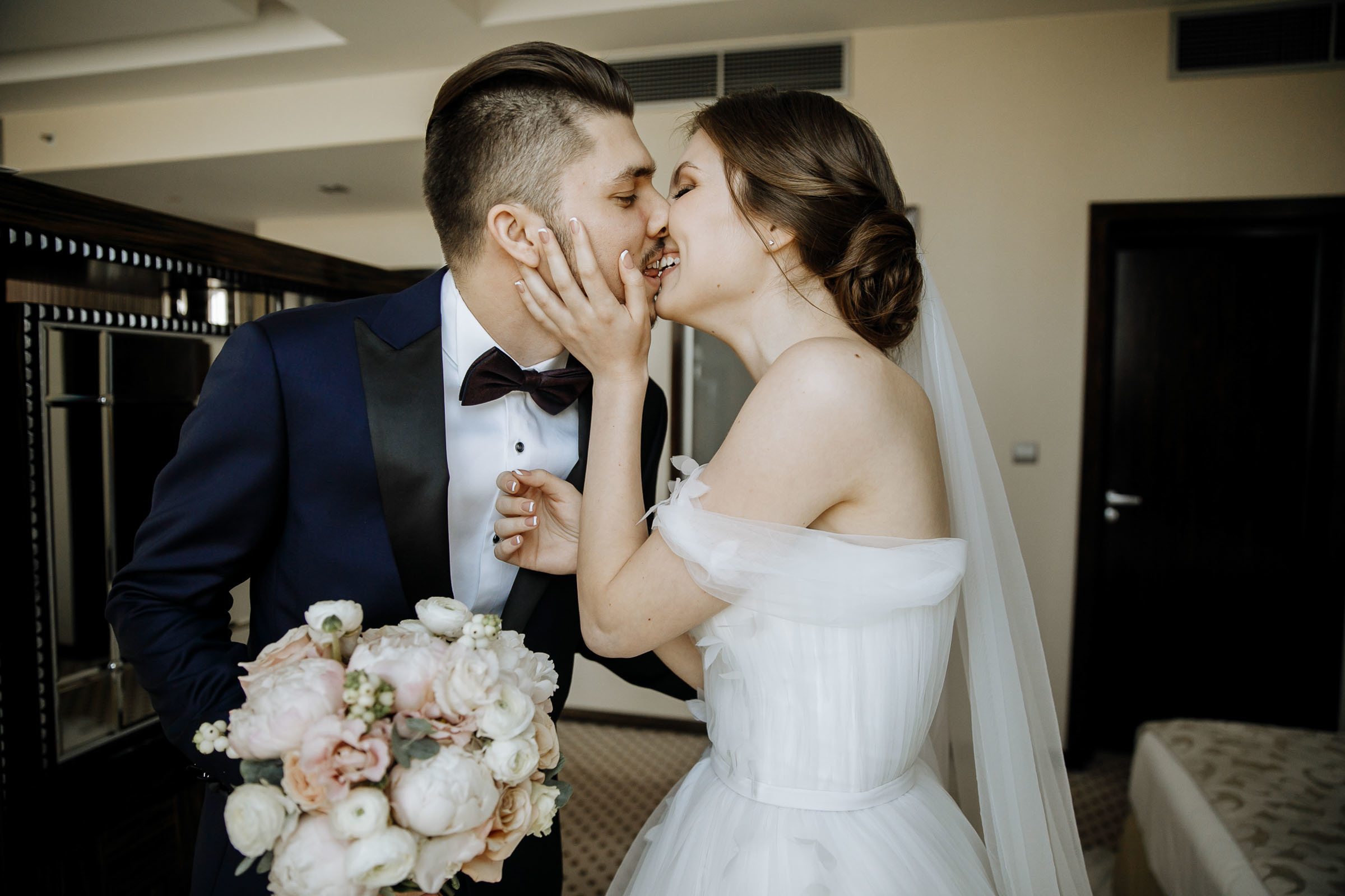 Bride and groom kiss after first look, by Tanya Bogdan, Bude, Cornwall wedding photographer.  
