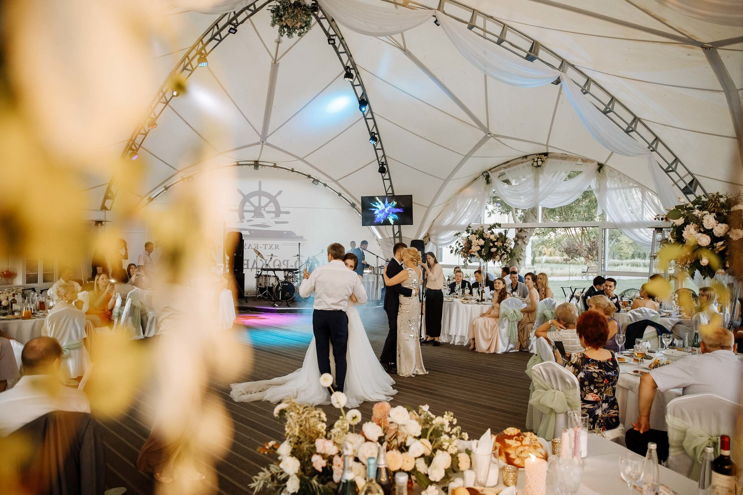 Guests grooving under marquee, by Tanya Bogdan, Truro wedding photographer.  