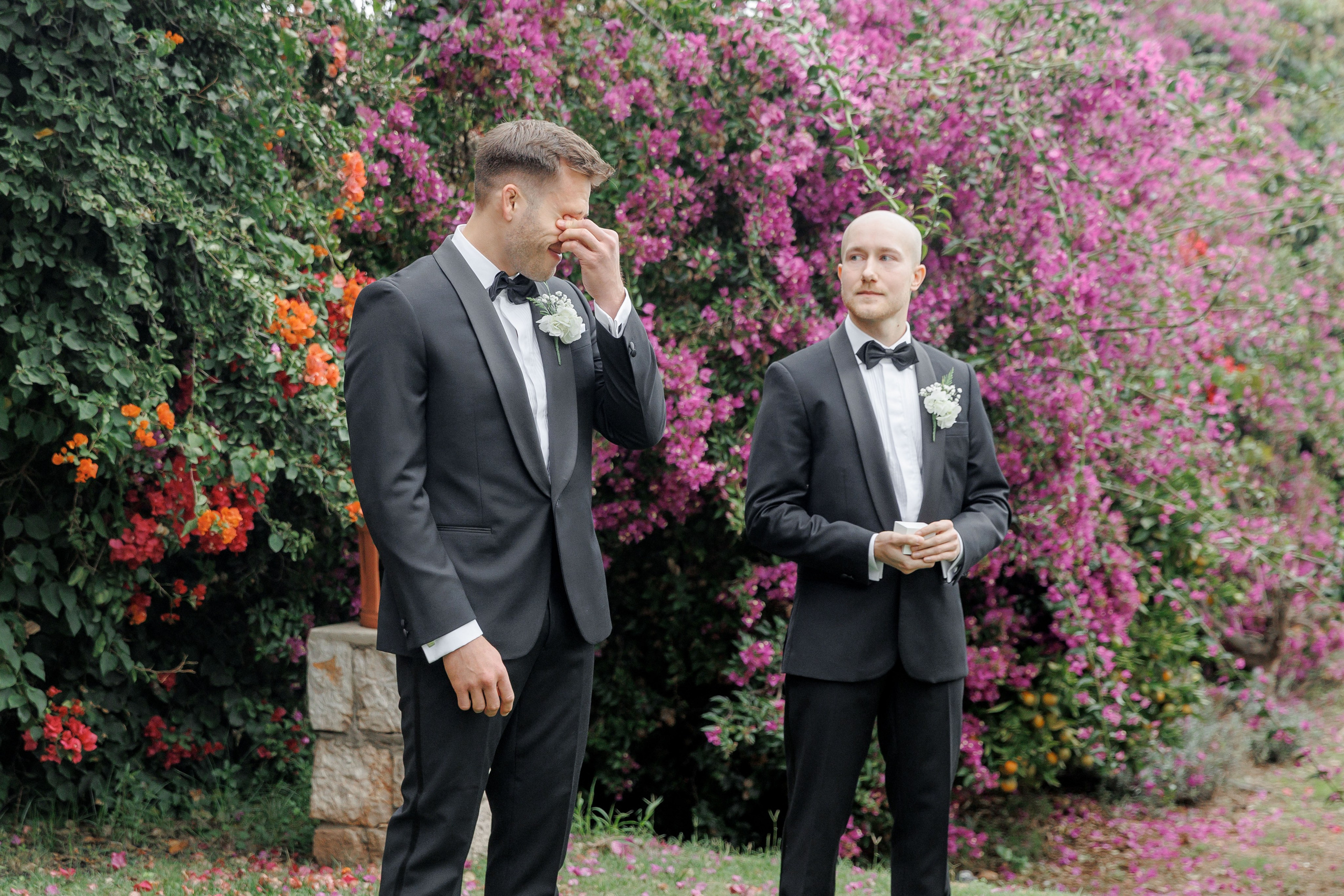 Emotional groom during the wedding ceremony in Barcelona, capturing expressions as he sees his bride walk down the aisle.