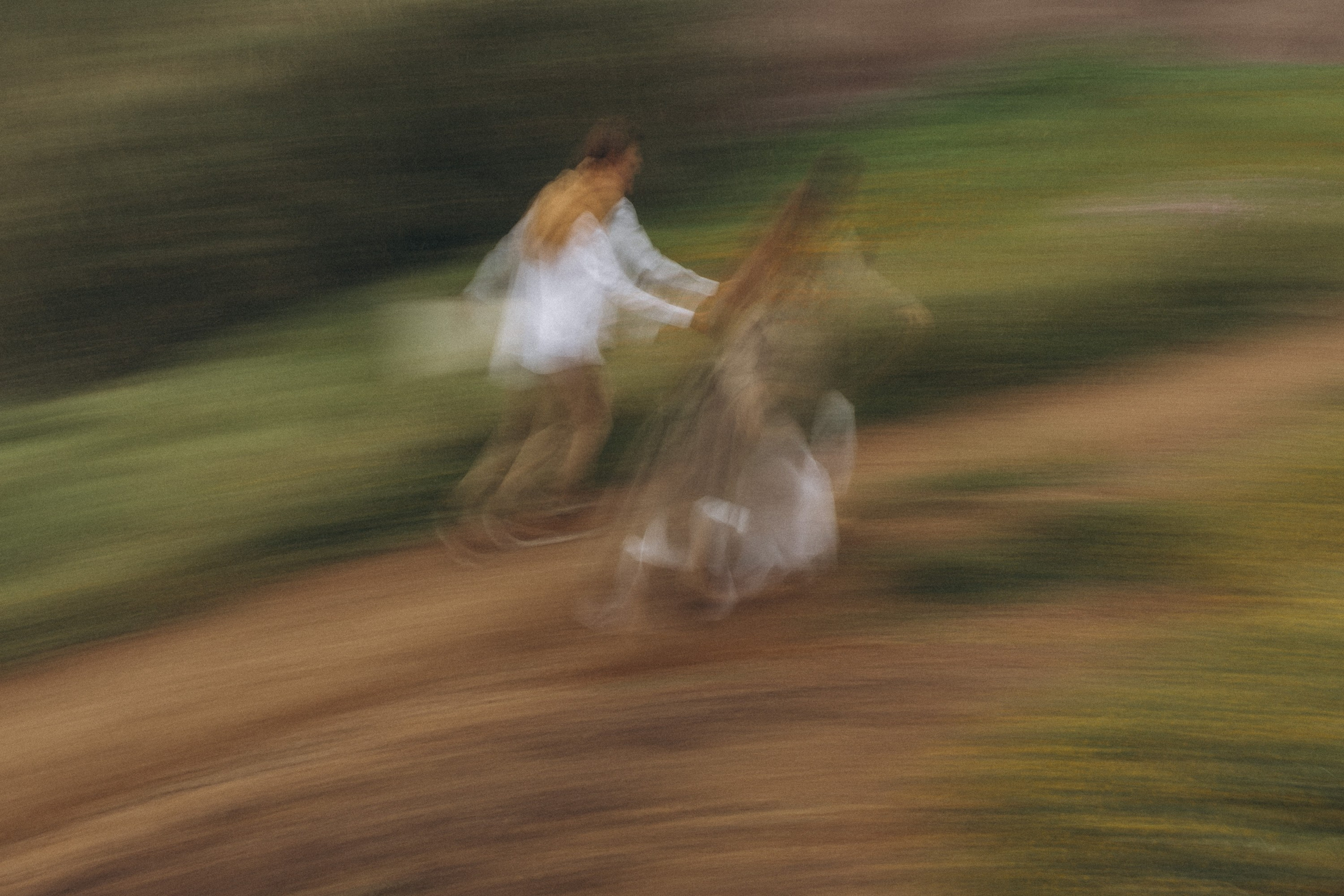 Romantic surprise proposal at sunset on a scenic cliffside in Madeira, Portugal, capturing the emotional moment of love and commitment.