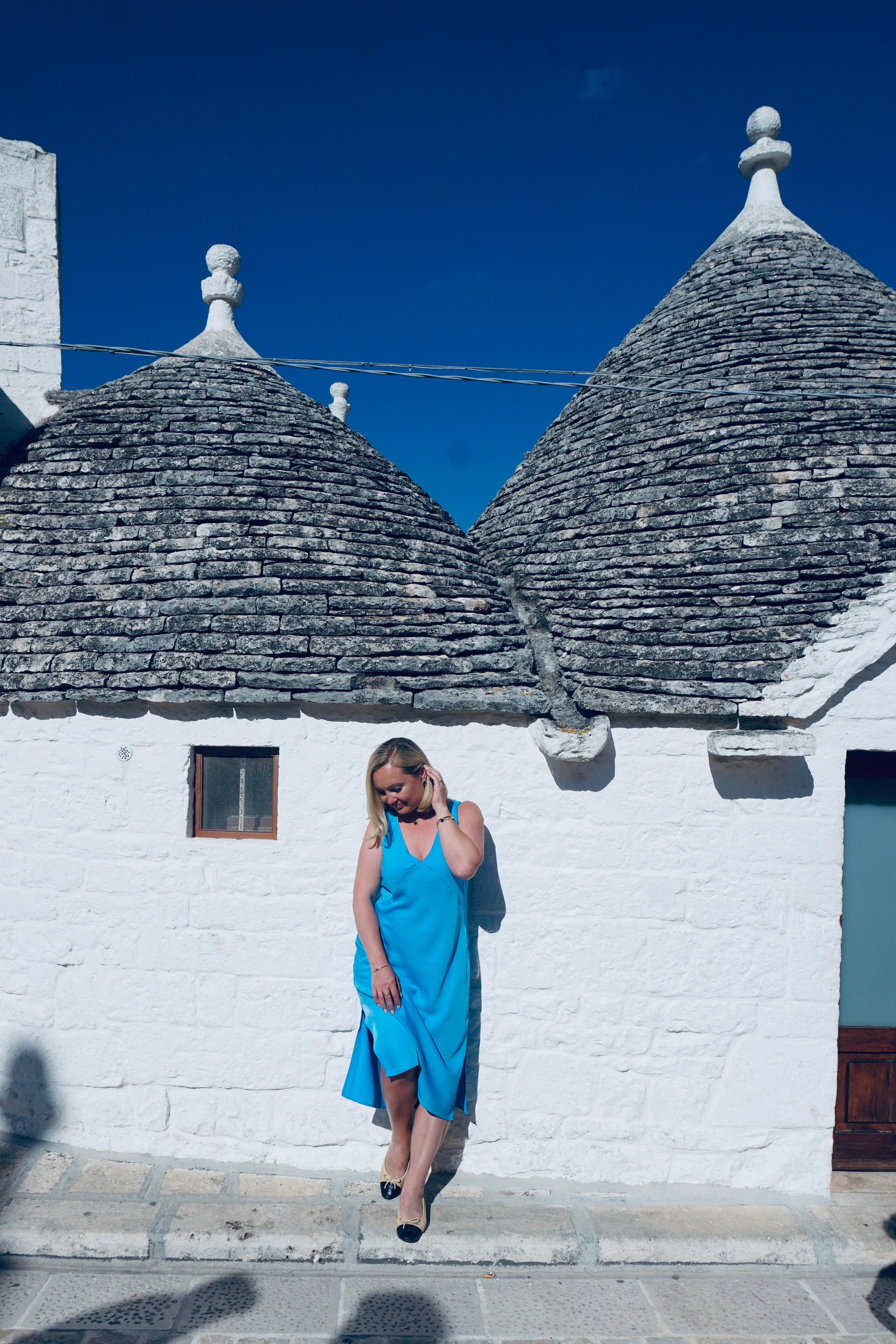 Passeggiata ad Alberobello con turisti americani felici. Videografa e Fotografa in Italia Sokhova Albina