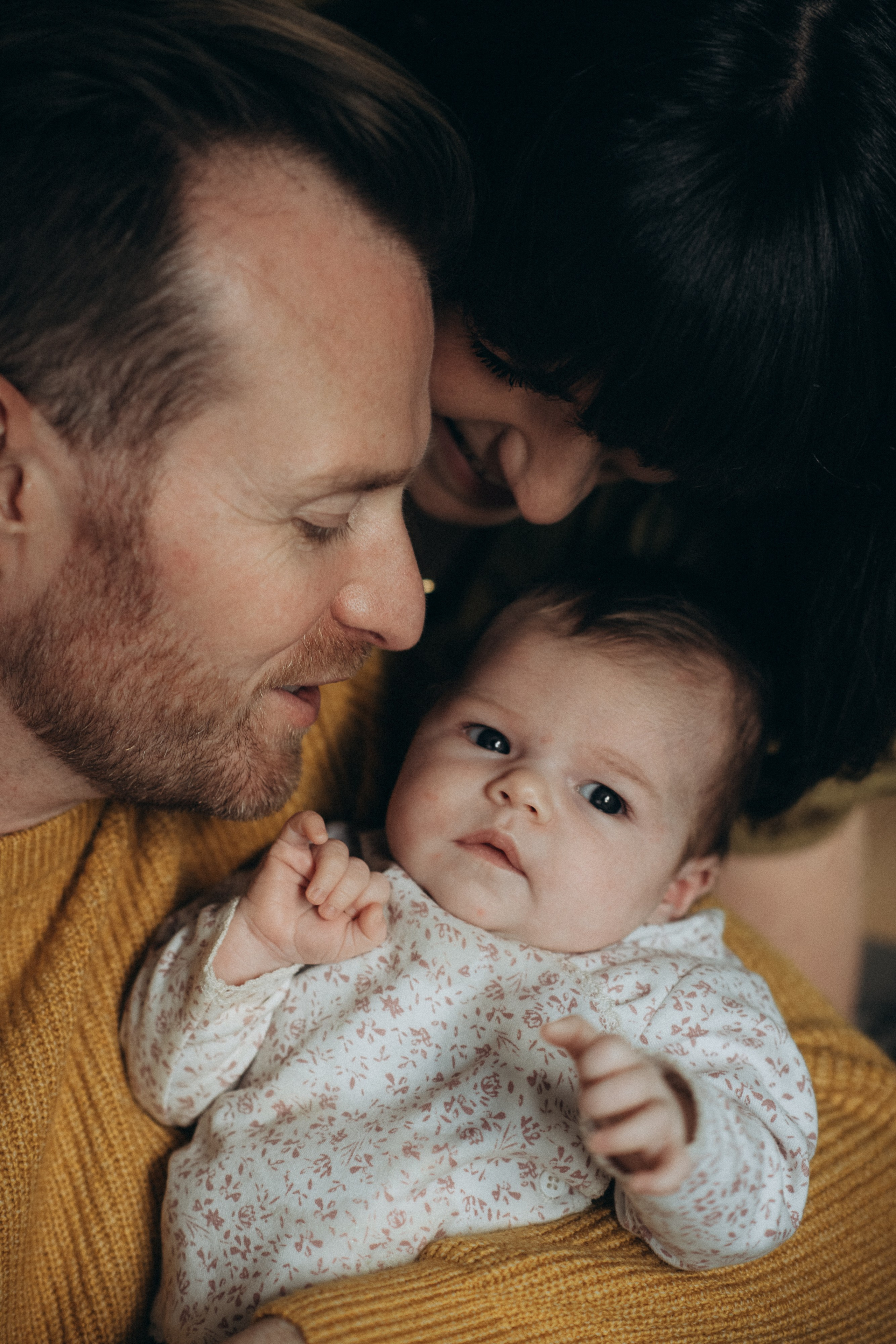 young father with his newborn baby girl