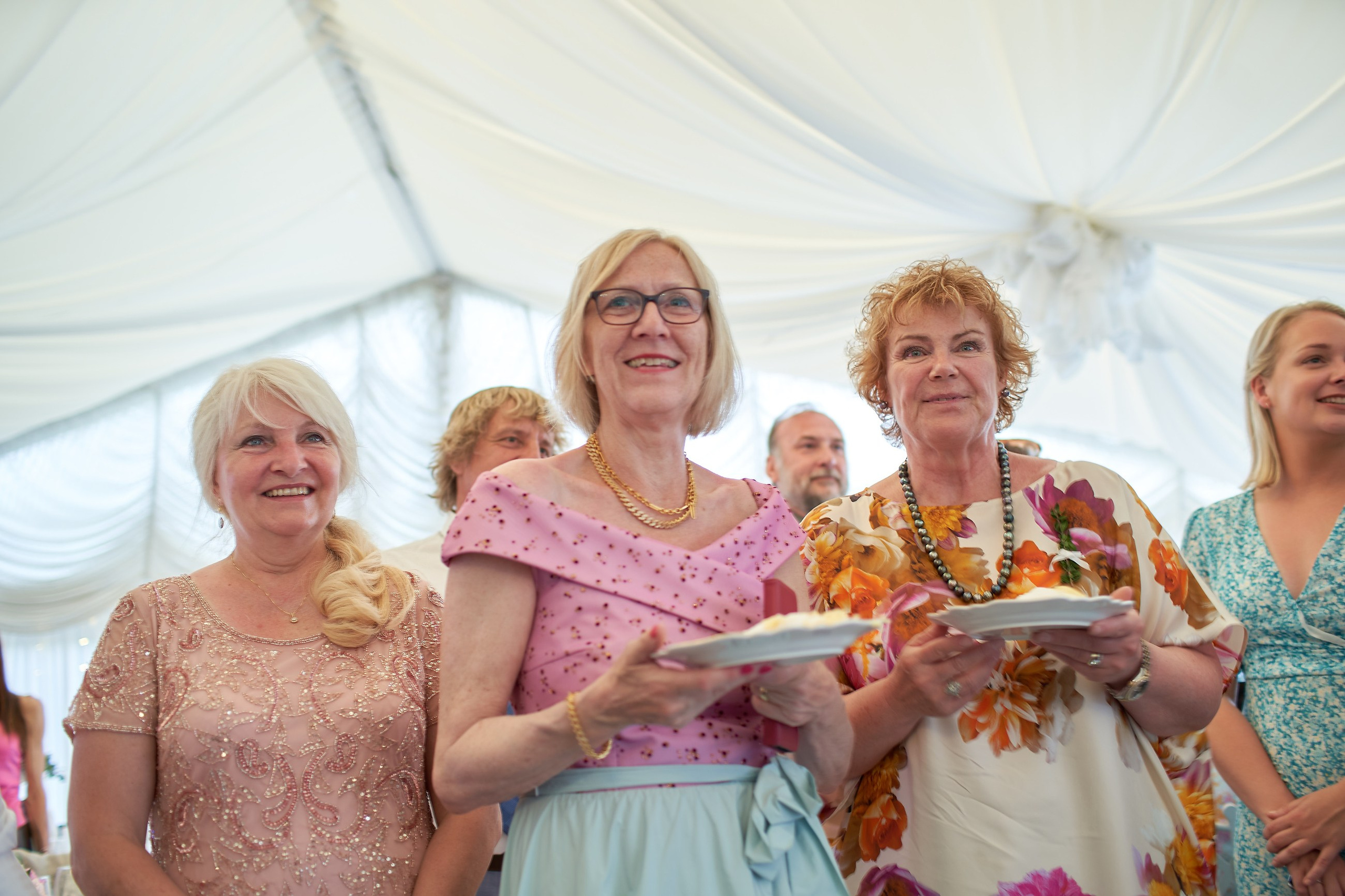Family members enjoying the wedding cake
