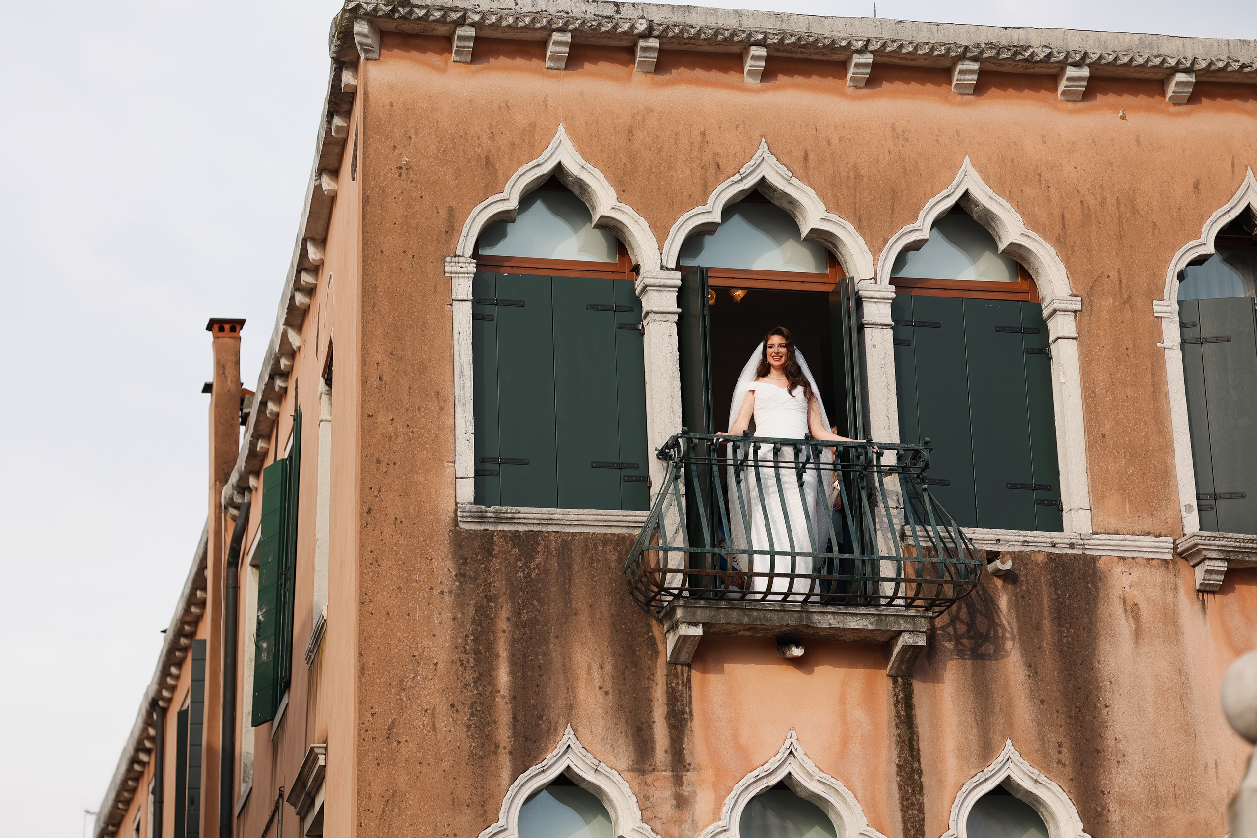 Bride in Venice balcony 