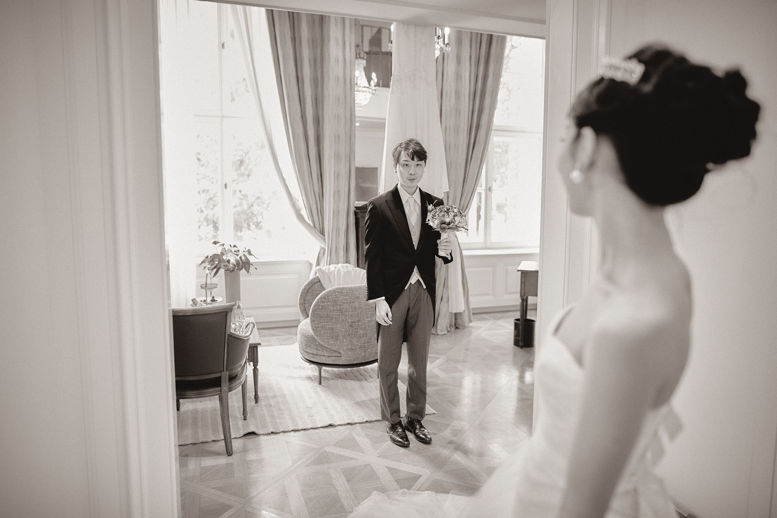 The groom eyes his bride.