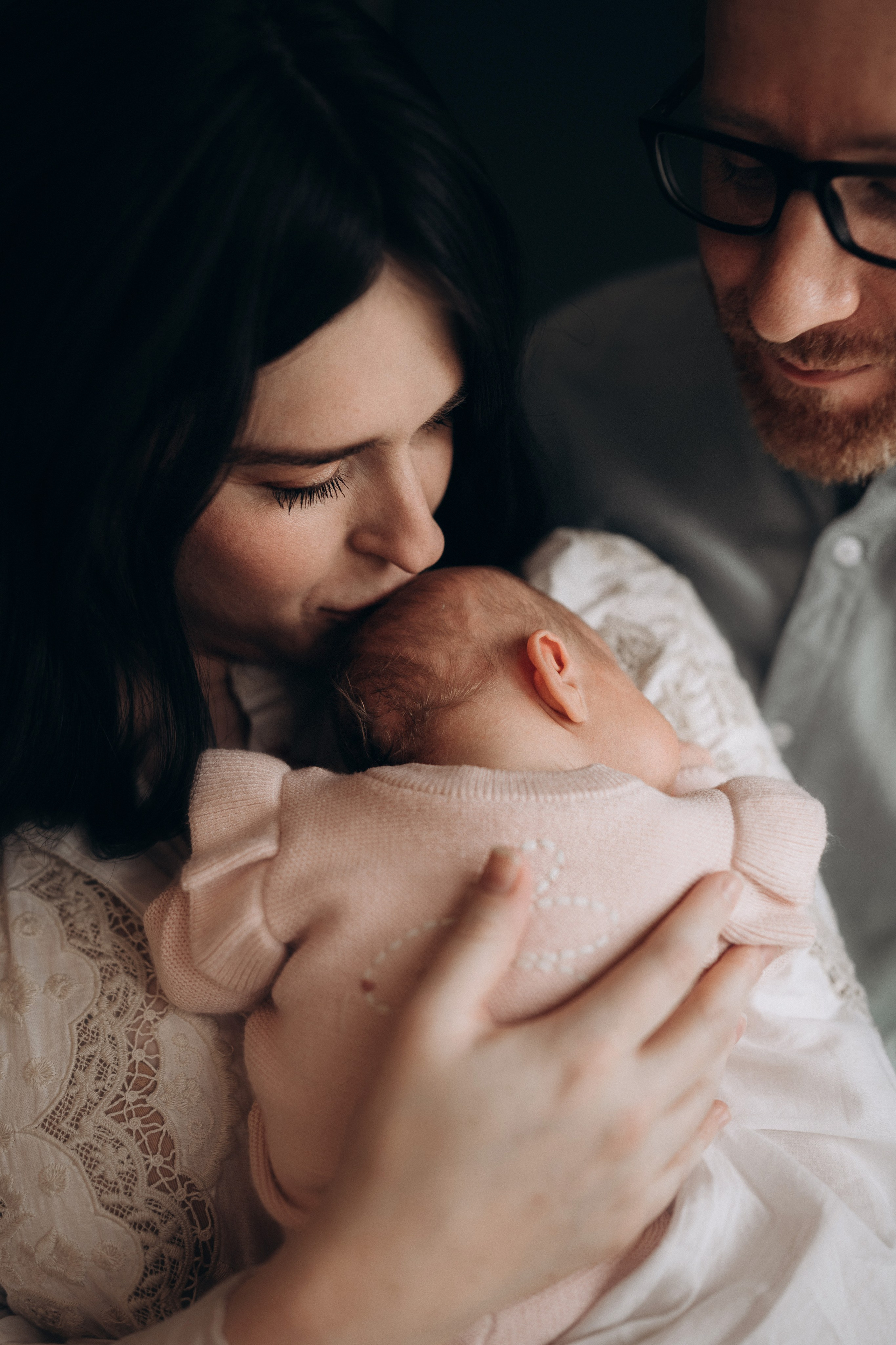 mum kissing the baby portrait