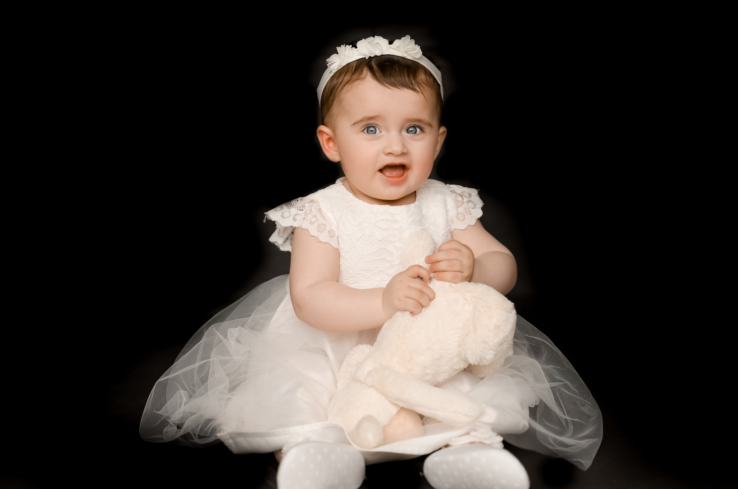 Black background. Family & children’s photographer in Herts & West London Iryna Blair