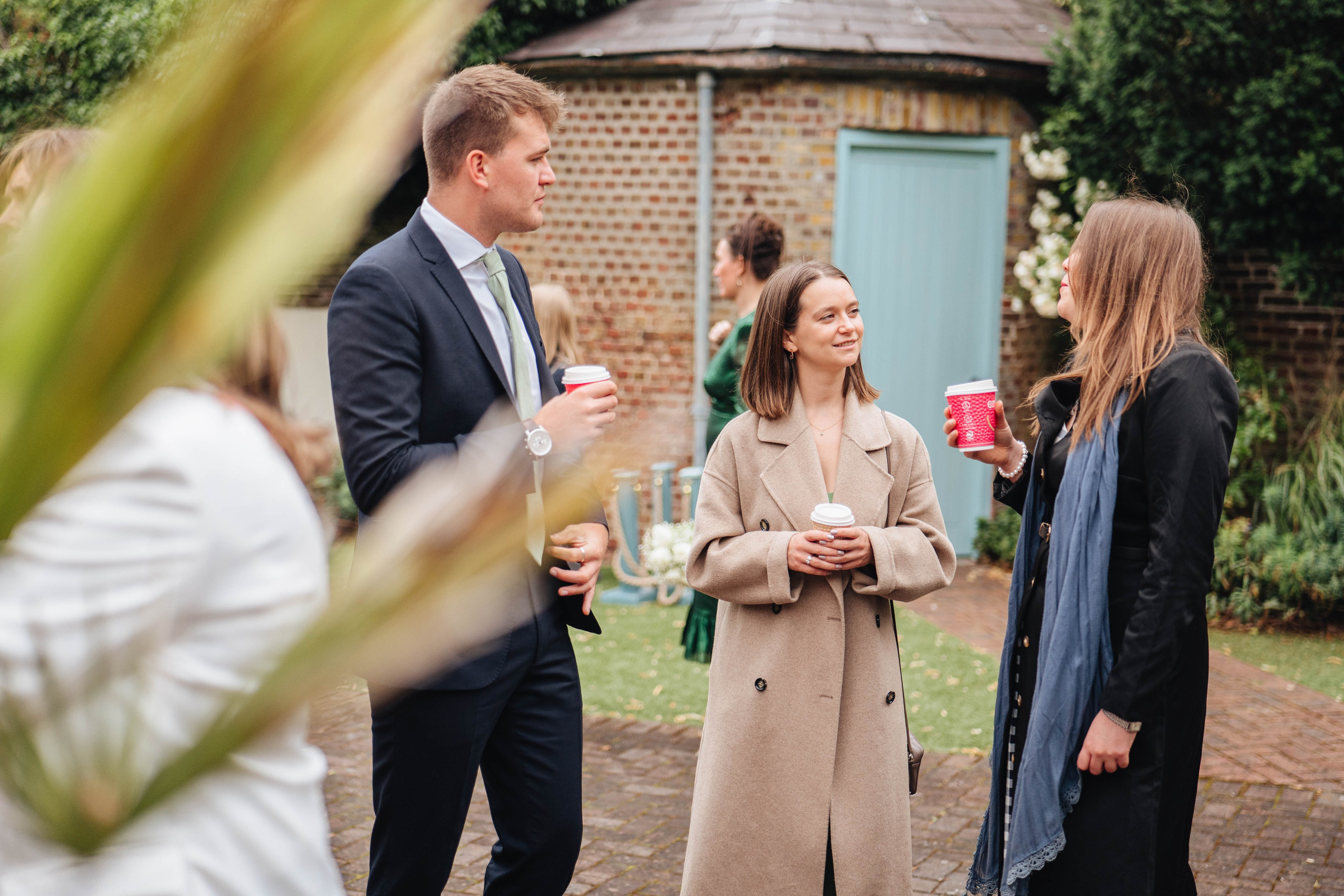 wedding guests chatting to each other before the ceremony