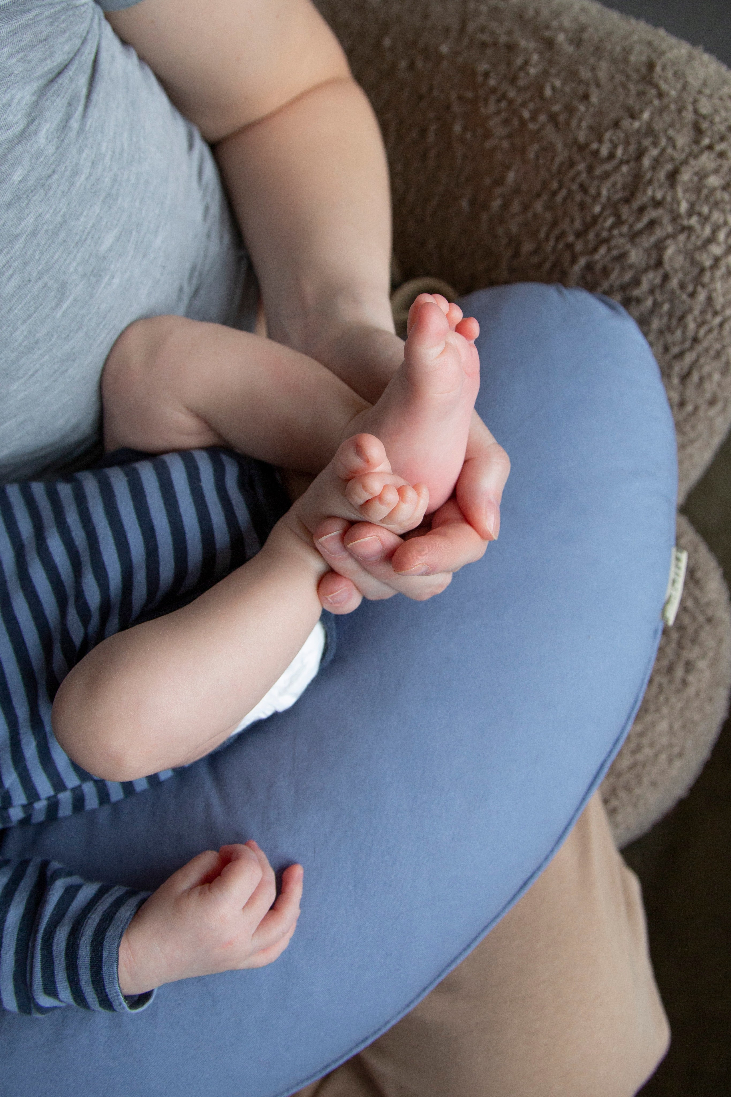 Newborn baby's legs, tiny and delicate, captured in a moment of innocence and wonder